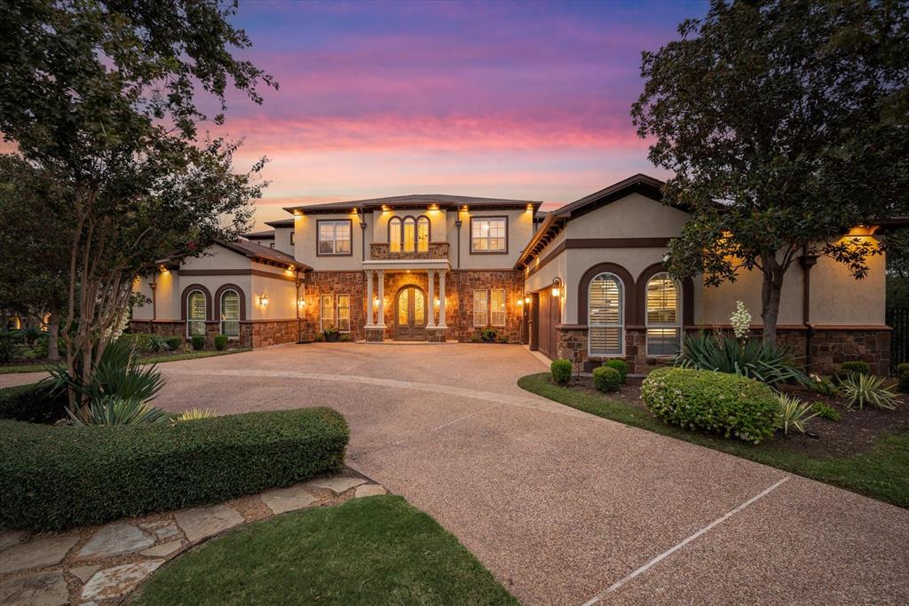 Nestled within the prestigious guard-gated community of Point Noble overlooking Grapevine Lake, this extraordinary estate redefines luxury living. Offering 7 bedrooms, 6 full baths, and 2 half baths, the home welcomes you with a grand entry showcasing dramatic double curved staircases and timeless elegance throughout. Formal living and dining rooms are designed for memorable entertaining, while the executive study with custom built-ins creates the perfect work-from-home retreat. Walls of windows frame picturesque views in the spacious family room, complete with balcony access for seamless indoor-outdoor living. The gourmet kitchen is a chef’s dream featuring a center island, dual sinks, dual dishwashers, gas cooktop, double ovens, pot filler, and built-in refrigerator. The private primary suite is a true sanctuary with its own sitting room and fireplace, plus a spa-inspired bath with jetted soaking tub, oversized shower with shower body sprays and 3 custom walk-in closets with a private washer & dryer. An elevator provides convenient access to every level of the home. The walkout basement is built for entertainment and relaxation with a tiered floor media room, expansive game room, exercise room with wet bar and sauna, a spacious guest suite and an additional bedroom. Upstairs, you’ll find 3 spacious bedrooms with walk-in closets along with a second game room overlooking the property.  What feels like a Hill Country resort is actually your own backyard, complete with sparkling heated pool and spa, fire pit, and full sport court for basketball and tennis. The covered patio with built-in grill is perfect for relaxing and entertaining. A charming detached casita offers a full kitchen and bathroom, ideal for guests, extended family, or multigenerational living. Surrounded by mature shade trees and accented by balconies overlooking the treetops and lake, this is the lifestyle you’ve always imagined.