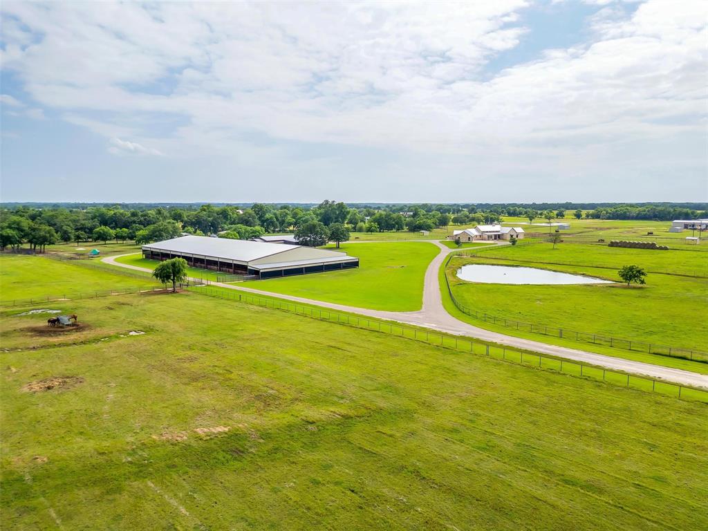 Welcome to Whispering Winds Ranch—a premier equestrian estate in Whitesboro, just an hour from Fort Worth. Spanning 68± acres of rolling pastures and mature oaks, this meticulously maintained ranch offers the ideal blend of luxury living and functional horse facilities. The heart of the property is a 5,000± SF custom ranch-style home, designed with timeless Texas charm. Inside, you'll find soaring beamed ceilings, stone accents, and an open-concept layout with 5 bedrooms, 6.5 baths, and multiple living areas. The expansive covered patio overlooks a resort-style pool with rock waterfalls and a fire pit, creating the perfect backdrop for entertaining or relaxing under the stars.

Tucked behind the arena, separate guest quarters offer a private and convenient space for visitors, full-time help, or traveling clients. The equestrian infrastructure is second to none. The main show barn includes 10 well-ventilated stalls with individual covered runs, automatic waterers, feeders, and drop-down grills. A custom tack room, two hot & cold wash racks, roll-up doors, laundry, and a bathroom complete the setup.

The 140’x250’ covered arena features LED lighting, two Big Ass Fans, and ample room for any discipline—whether you’re roping, working cattle, or jumping. Additional barns add more stall space and storage, while a 3-stall shed row barn includes water and tack storage with a roll-up door. The original barn includes 4 oversized stalls, breeding stocks, feed storage, and covered parking. Water and electric are thoughtfully routed throughout, and 8 cross-fenced turnouts ensure flexibility for rotation, rehab, or everyday use.

This turnkey property is a true Texas horseman’s haven—offering refined living and professional-grade equestrian amenities in one remarkable package.