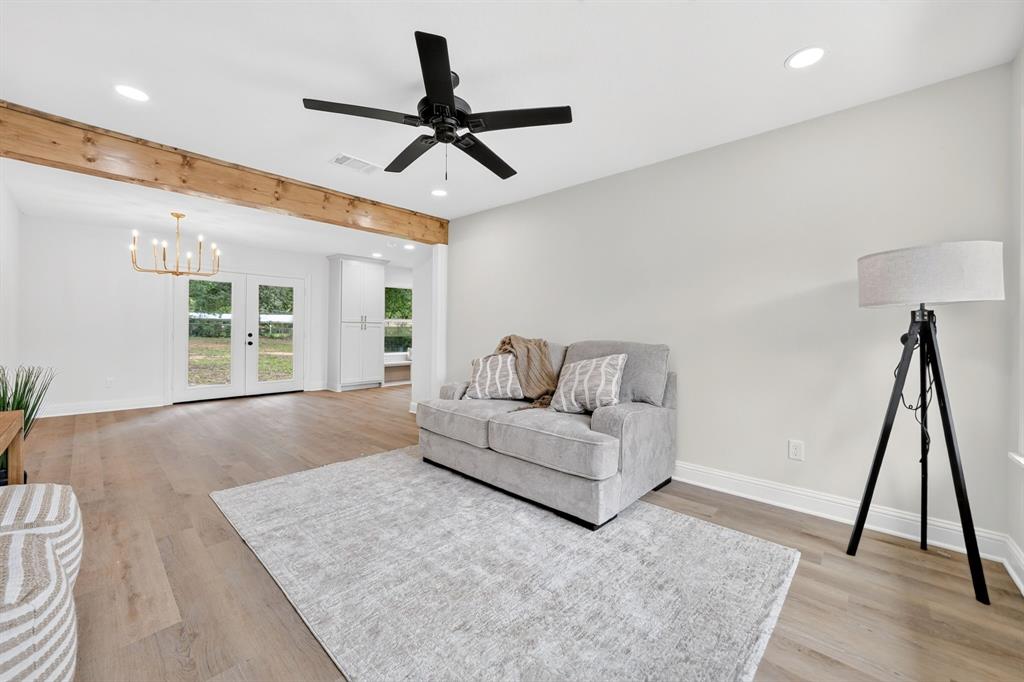 This completely renovated mid-century modern home sits on a 0.4 acre lot surrounded by mature shade trees just blocks from the Athens town square. Step inside to an inviting living room with luxury vinyl plank flooring throughout. The gourmet kitchen features stone counters, shaker cabinets, stainless steel appliances, farmhouse sink, and a built-in window seat. The primary suite accommodates nicely with an oversized walk-in closet with built-ins. Additional bedrooms share a second full bath, and each filled with natural light from oversized windows overlooking the treed lot. The backyard offers a private, wooded setting with room for a garden, firepit, or play set beneath the shade canopy. Minutes from the Athens town square, Lake Athens, Cedar Creek Reservoir, the Texas Freshwater Fisheries Center, and Trinity Valley Community College, this home puts East Texas recreation and small-town charm at your doorstep. Athens is known for its small-town charm, outdoor recreation, and beautiful East Texas scenery, all within reach of the Dallas metroplex. Proudly Claim Your Piece of Texas!