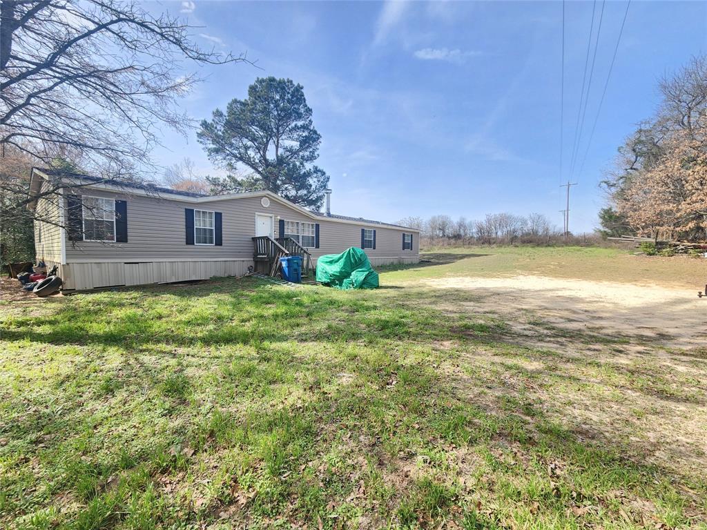 MOTIVATED SELLER, PRICED TO SELL!! 
Welcome to peaceful East Texas living on a full acre in beautiful Smith County! This custom 4-bedroom, 4-bath manufactured home offers the perfect blend of space, comfort, and functionality — ideal for families, entertaining, or anyone wanting room to breathe while still being convenient to town.
Inside, you’ll find a thoughtfully designed layout with generous living areas, abundant natural light, and a flowing floor plan that makes everyday living easy. The large kitchen serves as the heart of the home, featuring ample cabinetry, expansive counter space, and room for gathering — perfect for family meals or hosting guests. Each bedroom offers privacy and comfort, while four full bathrooms provide convenience for a busy household or multi-generational living.
The primary suite is a relaxing retreat with a spacious bath and plenty of storage. Additional bedrooms are well-sized and versatile — ideal for guests, home office, or hobbies.
Step outside and enjoy the wide-open acre, ready for gardening, pets, outdoor activities, or simply enjoying quiet country sunsets. There’s plenty of space for a shop, pool, RV parking, or future improvements — no cramped subdivision living here!