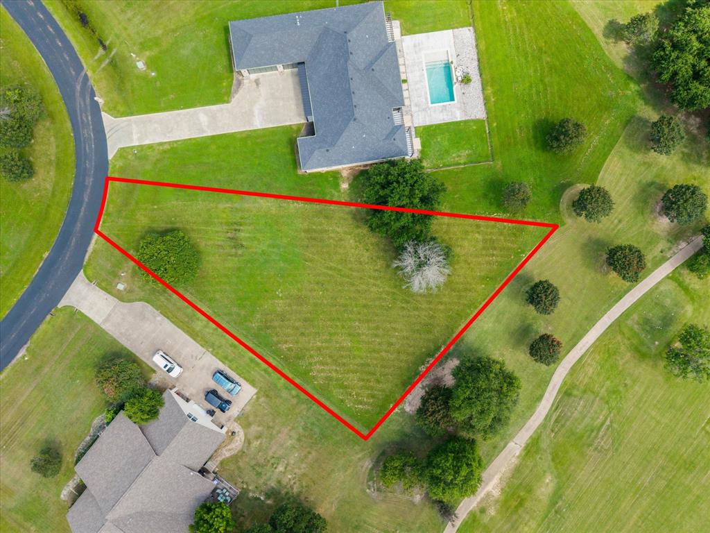Build your dream home on this exceptional homesite overlooking the beautiful Lake Fork Golf Course! Enjoy the perfect blend of peaceful country living and resort-style amenities in this family-oriented community. The challenging 18-hole golf course features a full-service clubhouse, making it easy to spend the day golfing, dining, and relaxing close to home. Located on the west banks of the world-famous Lake Fork Reservoir, known as the Bass Capital of Texas, you’ll have incredible fishing and boating opportunities just minutes away. Conveniently situated only about an hour from the DFW Metroplex, this build-ready lot offers the ideal escape for a weekend retreat or your forever home. Don’t miss this opportunity to own property in one of East Texas’ premier golf and lake communities