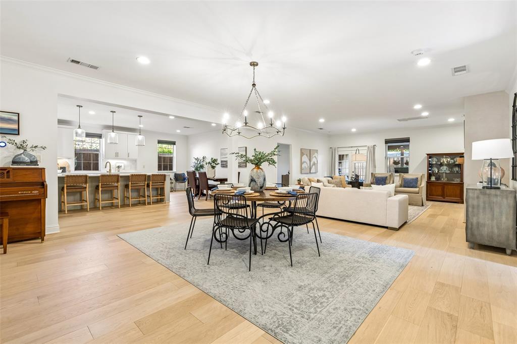 Located in the sought-after Midway Hollow neighborhood, this updated single-story home offers 4 bedrooms, 3 full bathrooms, 2,646 square feet, & style, comfort, & convenience. Built in 2015, the open-concept floorplan is filled with natural light & designed for everyday living & entertaining. The kitchen was renovated in 2025 & features a 10-foot quartz island, gas cooktop, soft-close cabinetry, walk-in pantry, designer backsplash, under cabinet lighting, inset vent hood, updated hardware, modern faucet, & new dishwasher. White oak engineered hardwood flooring installed in 2025 enhances the kitchen, family room, dining room, pantry, & laundry room, creating a warm, seamless flow throughout the main living areas. The inviting family room is anchored by a beautifully remodeled fireplace with a smooth plaster finish, custom mantel, & inset TV. The spacious primary suite offers dual vanities, a garden tub, separate shower with dual shower heads, excellent water pressure, & a large walk-in closet. Three additional bedrooms provide flexibility for family, guests, a home office, or workout space. Additional improvements include a new AC unit in 2025, fresh interior paint, updated lighting with dimmers, & custom closet systems. Enjoy the covered patio overlooking an easy-to-maintain turf backyard, ideal for relaxing, grilling, pets, or play. Oversized driveway provides additional parking beyond the attached 2-car garage, a rare convenience in this central Dallas location. Walk to Central Market, Summer Moon Coffee, Target, Chick-fil-A, & Cantina Laredo while enjoying quick access to Love Field, DFW Airport, Downtown Dallas, the Medical District, shopping, dining, major employers, parks, & everyday conveniences. With extensive recent updates, a functional one-story layout, spacious bedrooms, beautiful finishes, & a prime location near the best of Dallas, this move-in ready home offers comfort, convenience, & lasting value in one of the city’s most desirable neighborhoods.