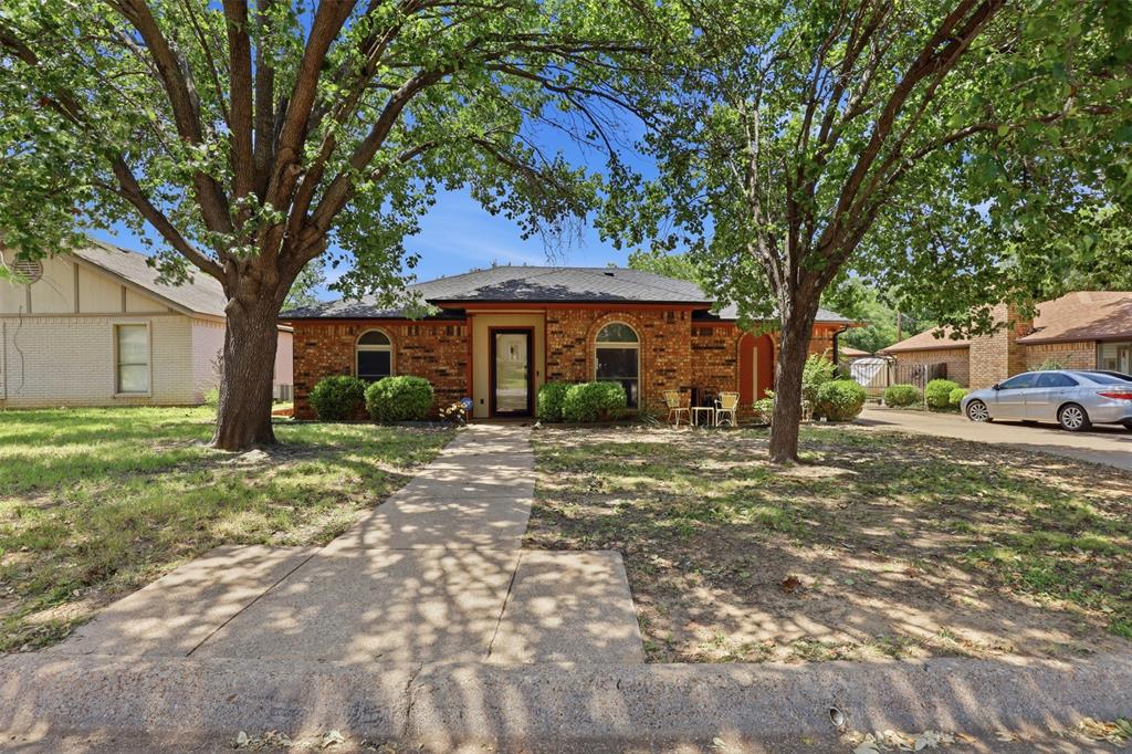 Looking for a home in Arlington, TX with flexible living space, modern updates, and convenient access to shopping, dining, entertainment, and major highways? Welcome to this well-maintained split-level home in the heart of Arlington, perfectly positioned between Dallas and Fort Worth and close to everything the DFW Metroplex has to offer. Step inside to warm laminate flooring and a functional layout designed for both everyday living and entertaining. At the front of the home, you'll find a formal dining area that could also serve as a home office, second living space, or study. The kitchen features granite countertops, ample cabinet space, and opens to the main living room, creating an inviting flow for gatherings and family time. The main level includes three spacious bedrooms, including one with a private en suite bathroom that could function as a primary suite, along with an additional full bathroom. Upstairs, a separate private suite with its own en suite bathroom offers an ideal setup for a second primary bedroom, guest retreat, or multigenerational living. Downstairs, the walk-out basement provides endless possibilities for a game room, media room, office, craft room, workout area, or additional flex space. Situated on a large lot with plenty of room for kids, pets, and outdoor entertaining, this property also features a detached 2-car garage with extra storage space in the rear. Major updates include a Class 4 impact-resistant roof replaced in 2025 and an HVAC system replaced in 2024 with new ductwork installed. If you're searching for a unique Arlington home with character, space, and modern improvements in a prime DFW location, this is one you don’t want to miss.