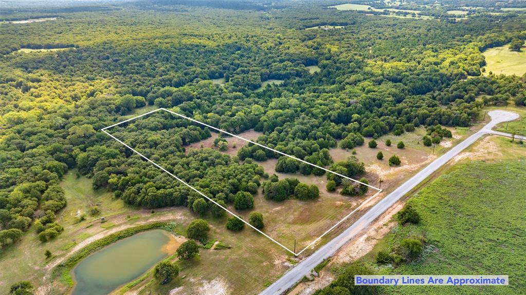 The Ranches of Blackjack Meadows is a wonderful new development located in far south end of Nocona, Montague County.. Lot 21  is 5.08 acres situated in back of subdivision for all the privacy you want or need.... This lot, with all its large Native trees,  is just waiting for you and your builder to come and make this your dream place. All roads are completed, electrical Poles are up and Fiber Optic Internet Service has been buried. Come check out this hidden gem of a sub-division, give me a call, love to meet you out there to talk about Lot 21. Also adjacent to this lot in Lot 20 listed on 
MLS  #21047014