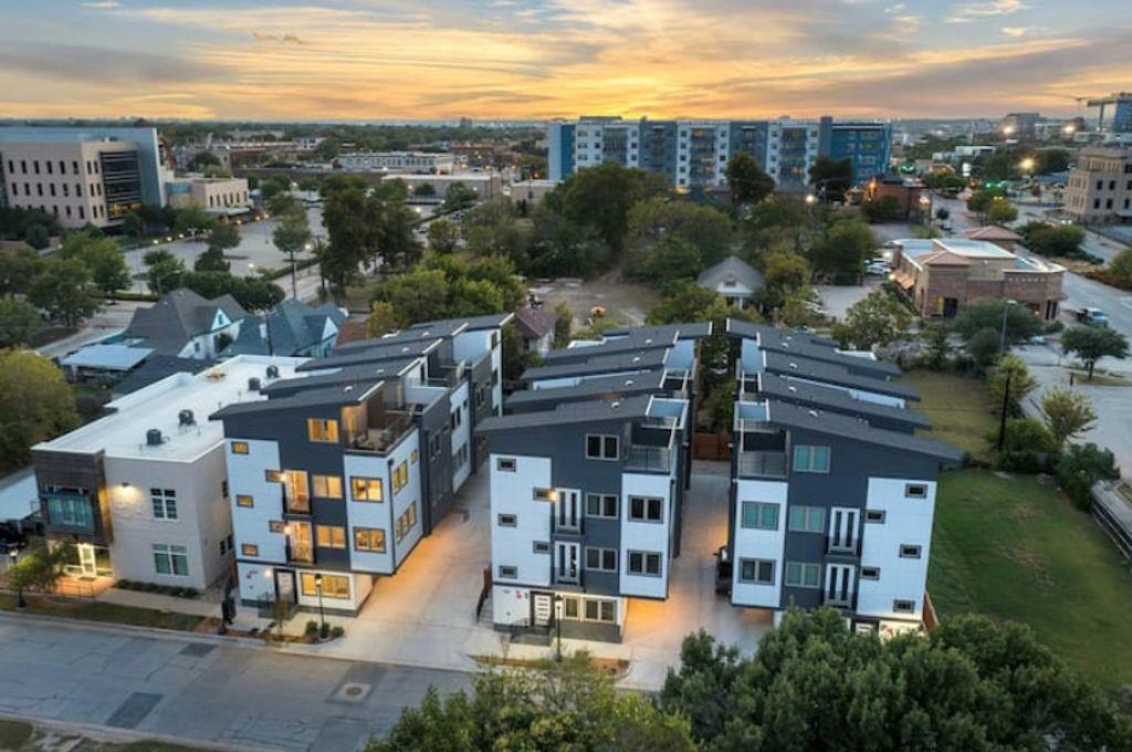 Five units, Situated in Fort Worth’s Near Southside, this boutique offering at 1120 Galveston Ave showcases modern luxury townhome living in a newly built urban condo development. Each multi-story residence is designed more like a private townhome than a typical condo, with individual entries, attached garages, and rooftop or upper-level outdoor spaces that capture downtown views and skyline ambiance.