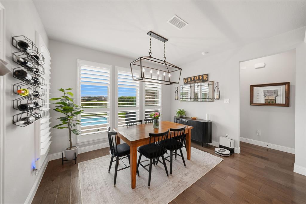 Step into style, space, & sophistication in this stunning 2021 built home offering approximately 3,353 sq. ft of thoughtfully designed living. Perfectly positioned on a desirable corner lot in the sought after Berkshire Richmond Community of N. Ft Worth, this 4 bedrm, 3 bath, designated office which also has a removable partition, mudrm, guest bedrm down, & 3 car tandem garage is a rare gem to find & will check every box. From the moment you enter, you will notice the elevated finishes & modern touches throughout. The high ceilings w beaming natural light through the windows from living rm w brand new remote controlled shades showcases the crisp white kitchen is totally a true show stopper, featuring an oversized island, elegant herringbone backsplash, gas cooktop, coffee & wine bar. The open concept layout flows seamlessly into the living area, highlighted by a cozy gas fireplace & walls of windows that frame serene greenbelt views and the outdoor paradise. Primary suite conveniently located on the first floor offers a luxurious retreat with a beautifully designed modern ensuite bath. Upstairs, enjoy endless entertainment w a spacious game rm & dedicated media rom perfect for movie nights & hosting guests. Step outside to your backyard oasis complete w an oversized covered patio & a gorgeous Gunite sparkling pool, all backing to a peaceful greenbelt where you can unwind and take in breathtaking Texas sunsets. Loaded with upgrades galore & designed for both comfort & style, this exceptional home blends luxury living w everyday functionality in one of the area's most desirable neighborhoods that offers an amazing pool, playground, catch release fishing, walking biking trails, & paint a rock & add it to the painted ROCK SNAKE trail. This LOCATION is amazing & is in the desirable Northwest ISD & is super close to Costco, Target, Alliance Town Center shopping including restaurant choices to savor your flavor. This home won't disappoint so don't let this one slip away.