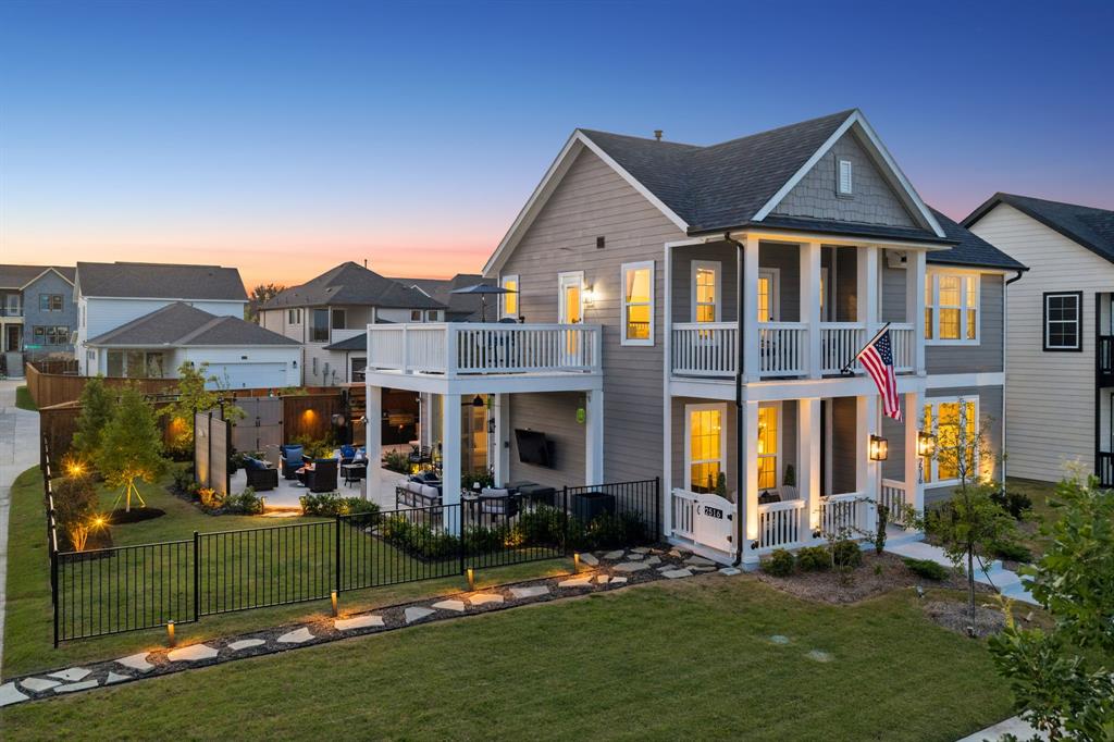 Perched above Lake Ray Hubbard in Rowlett’s highly sought-after Lake Park community, this fully furnished, 2025 turn-key residence offers a rare opportunity for modern construction, breathtaking water views, and resort-inspired outdoor living. Thoughtfully positioned across from the shoreline, the home captures panoramic lake vistas from multiple indoor and outdoor spaces, creating a setting that feels like a year-round vacation. Designed for those who appreciate relaxed living and thoughtful design, the interior showcases an upstairs gameroom, engineered wood flooring, iron stair balusters, quartz countertops, designer lighting, and expansive windows that frame the surrounding landscape. The kitchen serves as the centerpiece, featuring a dramatic waterfall island with seating, white cabinetry with upgraded hardware, GE Profile appliances, a 5-burner gas cooktop, wood vent hood, granite sink, pendant lighting, and abundant storage. The living area opens to the patio through stackable sliding doors that extend the living space outdoors, while the dining area extends to a covered patio with an outdoor kitchen. The private downstairs owner's suite offers lake views and a spa-inspired bath with a soaking tub, oversized shower, a double quartz vanity, and walk-in closet. Upstairs, the gameroom opens to two balconies with panoramic lake views and unforgettable sunrises over the water. Outside, there are covered living and dining areas, a fully equipped outdoor kitchen, mounted television, retractable awning, and multiple gathering spaces for relaxing or entertaining. Additional improvements include gated parking for a boat or extra vehicles, a greenhouse, storage building, potable water storage system, EV charging, and a 12,500-watt generator. Located just minutes from PGBT-190 and I-30, you'll enjoy shoreline trails, convenient access to shopping, dining, and entertainment, and easy access to major employment centers without crossing the I-30 bridge into Rockwall.