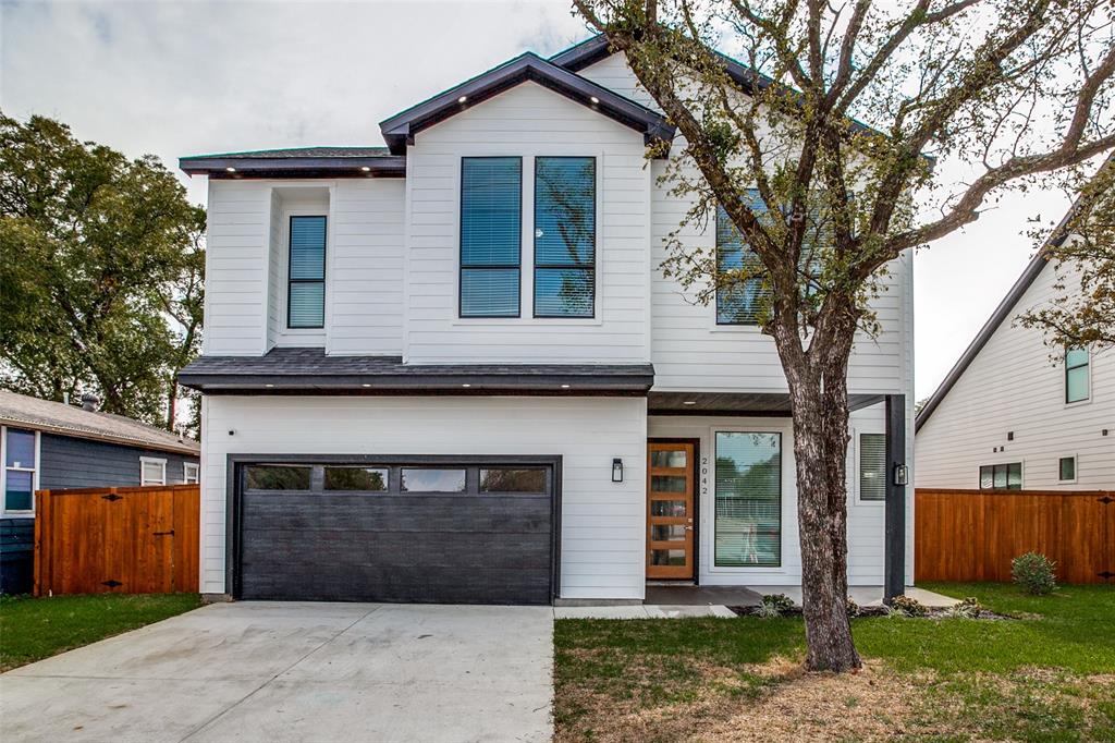 Enter this 2021 Custom built Contemporary Home through the welcoming Foyer featuring Wine Bar & Half Bath. Walk into the open LR, DR, Kit with soaring 20' ceilings & wall of windows to the 62' wide yard & 21x6 covered porch that is perfect for entertaining. Custom backlit cabinets, hardwds, two ovens, spacious walk in pantry, utility with room for 2nd pantry & a large quartz surface island are just a few of the many features. Downstairs Master Suite with oversized WIC , separate tub & shower. Upstairs loft open 13x10 with built in desk, 12x7 Office or Study with views to the Park, 2 additional BR featuring WIC & 2 Baths with one being ensuite. Close to Downtown, Medical District, Bishop Arts & Trinity Groves.