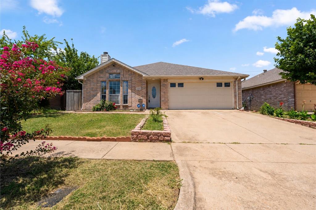 Welcome to 3129 Bahar Drive! Located in the quiet, established Woods of Timberlake neighborhood in East Arlington, this 2004-built single-story home offers an ideal blend of comfort and functionality. Featuring an efficient 3-bed, 2-bath floor plan across 1,401 square feet, the property showcases a welcoming family room anchored by a warm wood-burning fireplace. The layout features a spacious master suite separate from the secondary bedrooms for maximum privacy, a clean kitchen that flows easily into the living space, and an attached 2-car garage. Out back, you'll find a generous, fully fenced backyard perfect for weekend entertaining or pets. Minutes from major highways, local parks, and shopping, this low-maintenance brick home is an excellent opportunity for first-time buyers or investors looking for a solid turn-key property in the DFW metroplex.