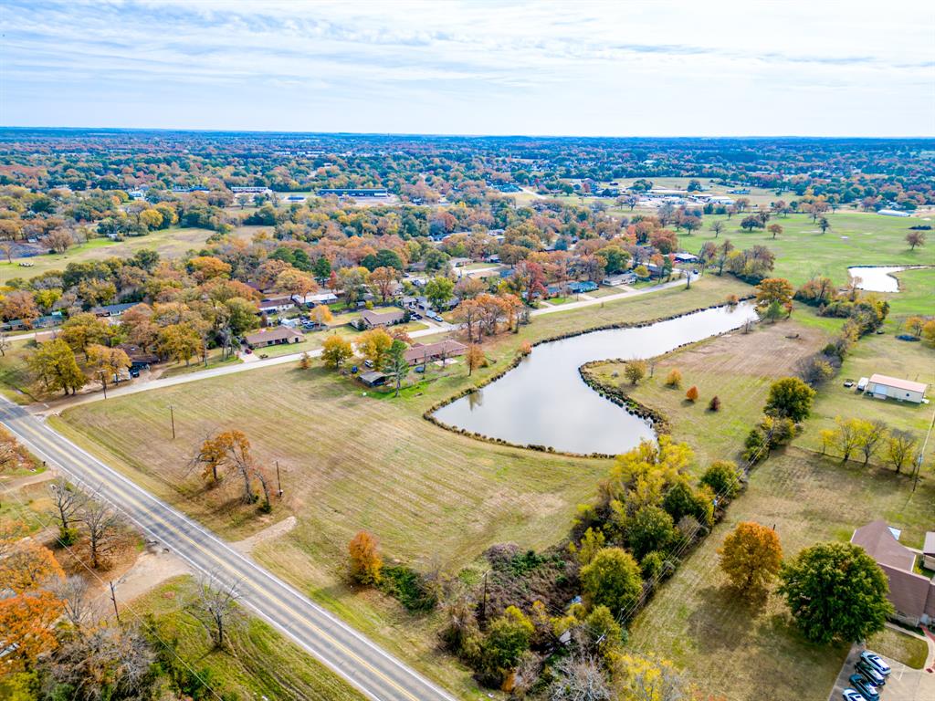 The opportunity to develop and build in Canton, Texas is here. Newly zoned Residential 2 with 10 acres (more or less) with large pond that has gorgeous views is now available.  Residential 2 allows for minimum 7500 square foot lots on this acreage. New buyer will need to get approval for subdividing lots with the City of Canton. Seller has shown lot renderings on the pictures that show approximate boundaries of 7500 square foot lots with water views as examples only. Two existing entrances off of Hwy 243. The property is absolutely beautiful with the pond and trees and a terrific location to schools, downtown and First Monday activities. The lots shown as numbers 1-8 are currently in the A flood zone and will need some fill for elevation to build. Original brick home (not included in this sale) had an elevation certificate amended with FEMA and would be recommended for this area of the acreage. The future favors the bold and this opportunity in a community like Canton is rare.
