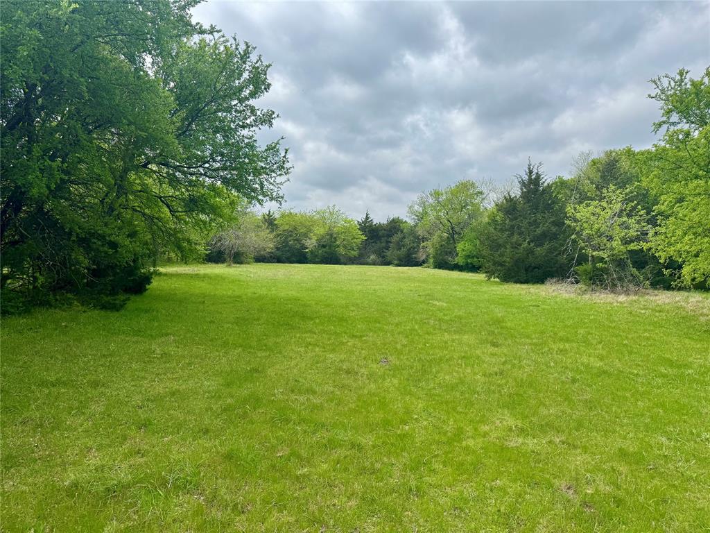 Everyone is searching for 5 platted acres, NO deed Restriction, in Hunt County, TX to build a barndominium, custom home, or family compound—and this property delivers. This AG-exempt, horse-friendly 5-acre tract offers the ideal blend of usability, privacy, and long-term value. Located in unincorporated Hunt County with a Greenville mailing address and Celeste ISD, featuring NO HOA, NO city taxes, No floodplain, water and electric available at the road, and NO deed restriction, for maximum flexibility. The Seller is motivated and says you will love it here.

The land showcases Crockett loam soil, well-suited for grazing, livestock, and agricultural use, making it ideal for those seeking a rural lifestyle with functionality. With dual road frontage on County Road 1037 and County Road 1196, access is convenient and flexible. Enter through the gate on CR 1196 and follow the natural lay of the land to a beautiful elevated homesite overlooking a pond, offering scenic views and a peaceful setting.

Surrounded by a mix of open land and well-maintained neighboring properties, including a new custom home across the street, this tract reflects the area’s growth while preserving its rural charm. Enjoy abundant wildlife including whitetail deer, open skies, and room to expand, perfect for a homestead, recreational retreat, or long-term investment.

The property is currently AG exempt, helping reduce property taxes. The tract is recently platted, this creating a clean path for development.

Strategically located with easy access to Greenville, Farmersville, McKinney, and Sherman, and just a short drive to the future Collin County Outer Loop and McKinney National Airport, this property offers both rural tranquility and strong growth potential. Nearby attractions include the Chaparral Trail for horseback riding, hiking, and outdoor recreation. Information deemed reliable; buyer to perform due diligence. Boundary lines are approximate.