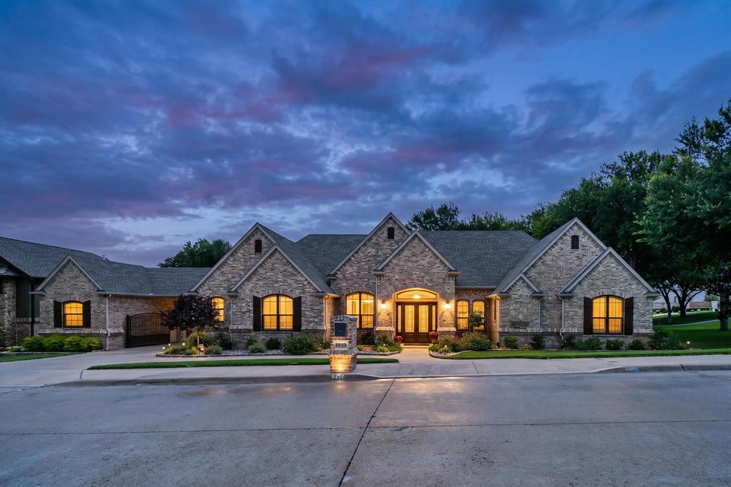 ** ASSUMABLE VA LOAN AT 1.75%** Nestled within one of the area's most desirable communities, this exceptional 3,676-sqft single-story estate offers a rare blend of luxury, privacy & timeless craftsmanship. With 4 bedrooms, 3.5 baths, a dedicated office, and beautifully designed living spaces, this home was created for those who appreciate both elegance & everyday comfort. From the moment you arrive, the home's stately presence & inviting curb appeal set the stage for what awaits inside. Rich pecan wood floors flow throughout the main living areas, adding warmth, character & sophistication. The thoughtfully designed floor plan provides the perfect balance of open-concept living and private retreats, making it equally suited for entertaining guests or enjoying quiet evenings at home. The spacious living areas seamlessly connect to the outdoor oasis, where a sparkling pool and covered outdoor living area create the ultimate backyard retreat. Whether hosting summer gatherings, watching the big game outdoors, or simply relaxing by the water, this space was designed to be enjoyed year-round. Adding both elegance and functionality is the porte-cochère with an electronic gate leading to a private motor court and 3-car garage configuration, featuring a separate 1-car garage alongside the 2-car garage. The gated entry provides additional privacy while creating a grand arrival experience for homeowners and guests alike. Beyond the home itself, the lifestyle is equally impressive. Located near Eagle Mountain Lake, you'll enjoy convenient access to boating, fishing, and a variety of water sports. As a member of the LCPOA, residents have access to a private boat launch, lake access, parks, tennis courts, and community amenities that encourage an active and vibrant lifestyle. Combining luxurious finishes, a highly functional floor plan, exceptional outdoor living, this remarkable property offers more than just a beautiful home—it offers a lifestyle that few properties can match.