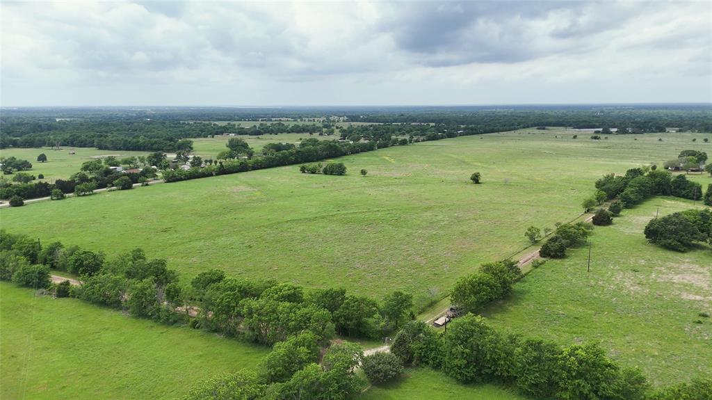 We are pleased to present an exceptional opportunity: a plus or minus 640-acre tract of land situated along VZ County Rd 2705 in Van Zandt County, TX, located near the growing community of Mabank. There is an 8 in. water line along VZ CR 2705 in which the City of Mabank has tentatively approved adequate supply for a new project. The city of Mabank will need to be contacted for details regarding final approval.. This expansive property offers nearly a mile of direct road frontage, ensuring convenient access for large-scale projects, and features a diverse topography that includes rolling hills, expansive pastures, mature woodlands, and natural water features, including two large 9 and 4 acre stocked tanks—offering both aesthetic appeal and functional versatility for multiple uses.

The varied terrain, with its gentle elevation changes, provides multiple opportunities for master-planned communities, company hunting getaways, luxury estates, or mixed-use developments, with potential home sites offering scenic views of the surrounding countryside. The property’s open fields are well-suited for agricultural or recreational components, while the wooded areas and water features enhance its appeal for eco-friendly or leisure-focused projects. Its proximity to Mabank positions it within a region experiencing steady growth, with convenient access to US-175 facilitating connectivity to Dallas and the recreational amenities of Cedar Creek Lake, a popular destination for boating and fishing.

This parcel is ideally suited for developers seeking to capitalize on the increasing demand for rural yet accessible properties in East Texas. The substantial acreage allows for flexible zoning possibilities, whether for residential subdivisions, commercial ventures, or a private retreat, all within an hour of Downtown Dallas. Infrastructure considerations, including water, electric, and septic options, should be verified to align with development plans.