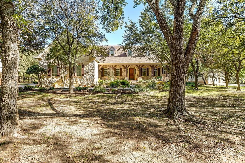 Picturesque country estate on 5+ AG EXEMPT, serene acres in Argyle ISD. Gourmet kitchen w oversized island, new Thermador double ovens, large WI pantry & coffee bar. Grand living room w vaulted beamed ceiling. Tons of natural light & hand scraped hardwood floors. Primary bedroom down w sitting area & custom closet. 3 add't bedrooms on 1st floor all en-suite bathrooms. Upstairs area is perfect flex room for media, workout or crafts. Enjoy sipping tea from your sunroom overlooking backyard & outdoor oasis w sparkling saltwater pool & pergola. New 30X50 dual door workshop w electric. Perfect for RV, ATV, boat. Detached 2 car garage w bonus upstairs w elec & water could easily be finished out into more living SF!