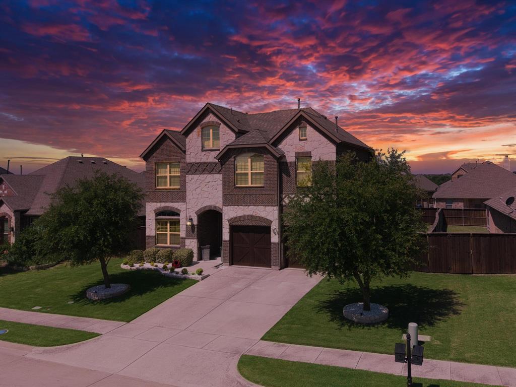 This beautiful 2 story home is loaded with personality and it shows! Upon arrival you’ll see the exterior brick and custom stone accents that have been strategically and architecturally placed that complete the finish out of this Tudor style home that only a skilled mason can provide, and cedar garage doors. Popular designer colors throughout that will attract you immediately and give you the you're at home feeling and a must see walk in closet that's loaded in space in downstairs office or can easily convert to a 5th bedroom also perfect for storage, crafts, or pop up gift closet. The arched entry way provides separation from the soaring and symmetrical ceilings throughout the living area and offer great views of the fireplace, staircase, the upstairs balcony game room that overlooks the open floor plan concept below with an island kitchen that features all stainless steel appliances, custom wood cabinetry, granite counter tops, and a coffee bar area too! The master bedroom features a gorgeous chandelier centerpiece, accented window treatments, barn doors that have been handsomely designed for privacy. Be sure and check out the master closet too as all that custom cabinetry remains with the home. The upstairs has a game room for additional living space and 3 nice sized bedrooms with spacious closets and full bath. The covered back patio overlooks the well maintained backyard perfect for a pool, and not a weed to be found. This beautiful home is located in Sonoma Verde, a master planned community that's loaded in amenities that feature a picturesque lake, community pool, tennis and sand volleyball courts, playground, and a busy HOA full of fun activities. It’s located minutes away from Forney, Terrell, major interstates where plenty of shopping and restaurants can be found and accessible to large area lakes too. You cannot build this home for this price as it offers way more square footage value than any local builder can provide.
