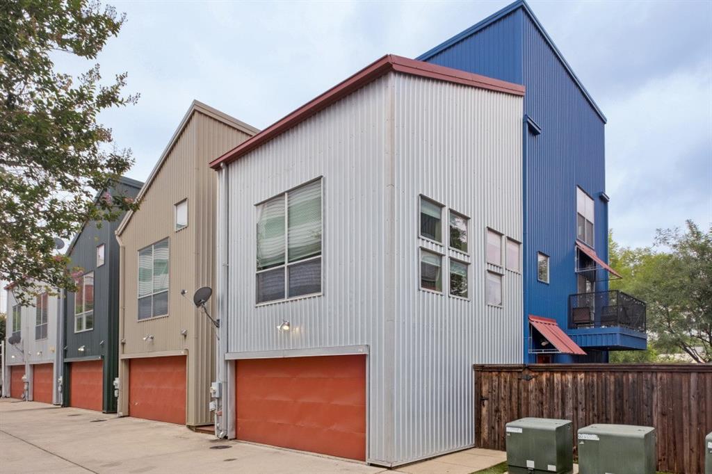 Fantastic three-story townhome located in The Cedars and walking distance to Dart.  This contemporary townhome sits on a corner lot and is light and bright, and features an open concept floor plan.  Beautiful wood flooring extends throughout the second floor, while stained concrete floors are highlighted on the first level.  Additional amenities include neutral paint, granite, stainless steel appliances, two-car garage, L-shaped outdoor entertaining area with a deck, tall privacy fence, a community electric gate, and very low HOA fees.  Centrally located to downtown Dallas, Central Expressway, and I-30.