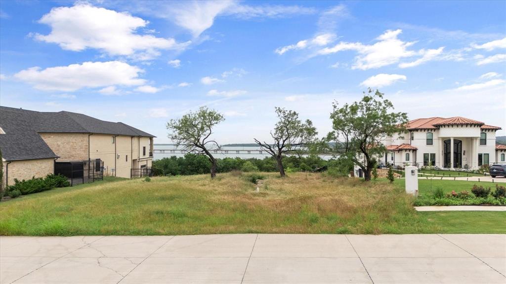 FABULOUS LAKE FRONT LOT, OVERLOOKING JOE POOL LAKE.  This .87 acre lot has breathtaking views of Joe Pool Lake and is surrounded by Luxury homes.  This lot was recently cleared  and is ready for you to build your dream home.  Bring your own builder or choose from several outstanding builders who specialize in this area.  Your daily dose of beautiful sunsets are waiting for you!  - call the listing agent today to make this fabulous property yours!