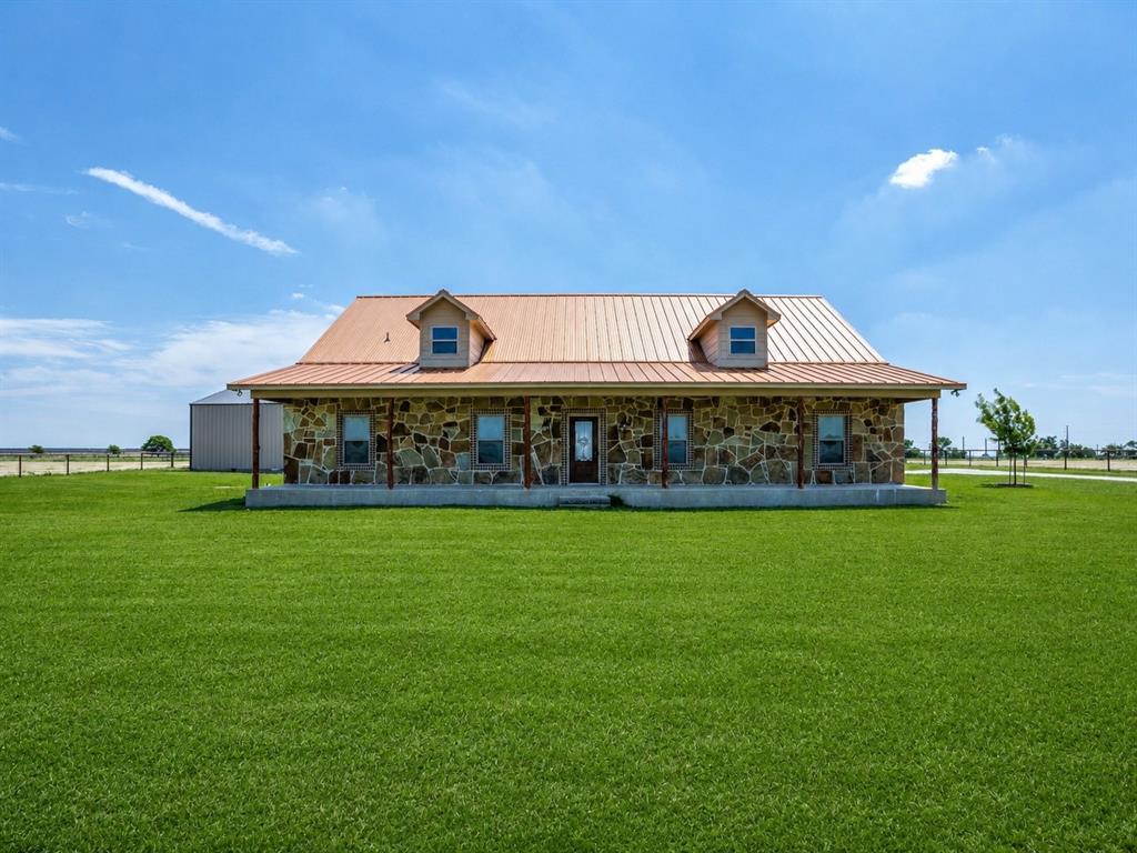 $25,000 SELLER CONCESSIONS! Tucked along a quiet county road in the heart of Cooke County, 1872 County Road 329 offers a beautifully maintained custom-built brick home on approximately 11.1 acres, blending modern comfort, usable land, and timeless North Texas countryside appeal. Built in 2017, this 3-bedroom, 2-bath residence offers approximately 2,509 square feet of open-concept living designed for both everyday comfort and effortless entertaining.

Inside, the home features a spacious kitchen with ample cabinetry, generous bedrooms throughout, and a cozy living room anchored by a fireplace. Multiple covered porches and a large deck extend the living space outdoors, creating the perfect setting to relax, entertain, and take in the breathtaking pasture views.

The property also includes a massive insulated metal shop, ideal for equipment storage, projects, hobbies, or small business use. With both a residential tract and an ag-exempt 10.1-acre parcel, the land is well suited for livestock, horses, weekend recreation, or a manageable North Texas homestead. Located just minutes from Gainesville and within the sought-after Era ISD, this property presents a rare opportunity to own land, space, privacy, and peace in one exceptional package.