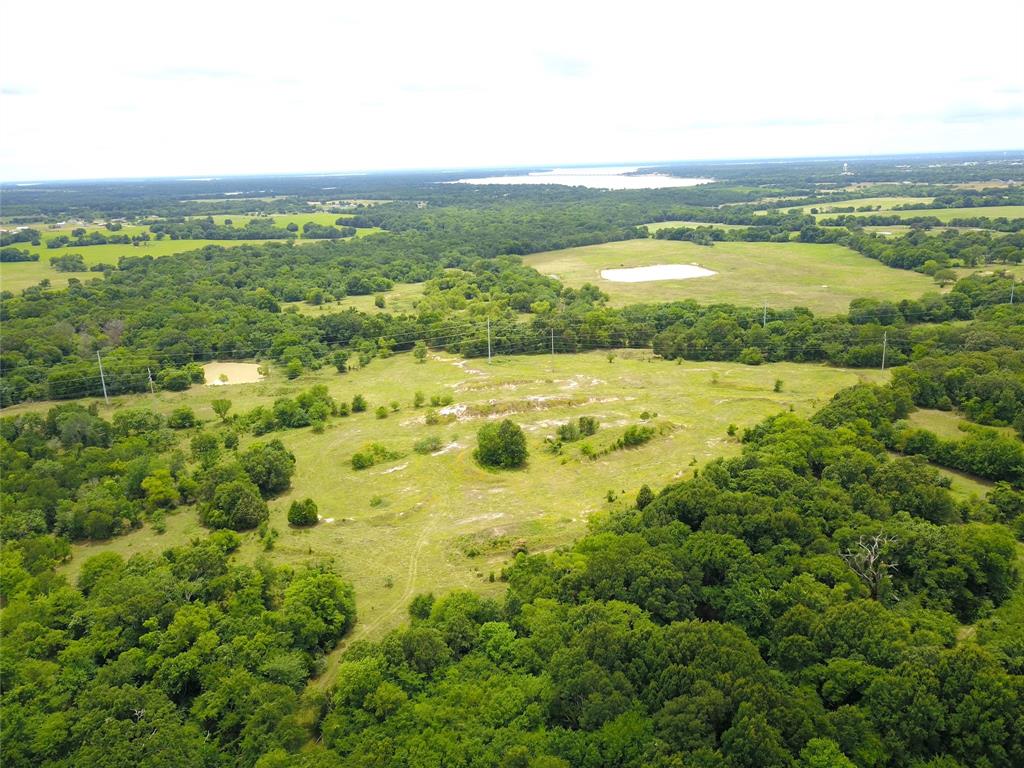 Stunning 34.6 acres just off Hwy 175 in Mabank! Beautiful entrance leads to open acreage featuring a pond, creek, and mature trees. Ideal for commercial or residential use with excellent visibility and easy access. Conveniently located minutes from downtown Mabank and a quick drive to Dallas or Athens. Whether you're looking to develop, invest, or build your dream property in a highly desirable location, this is a rare opportunity with endless potential in a growing area.