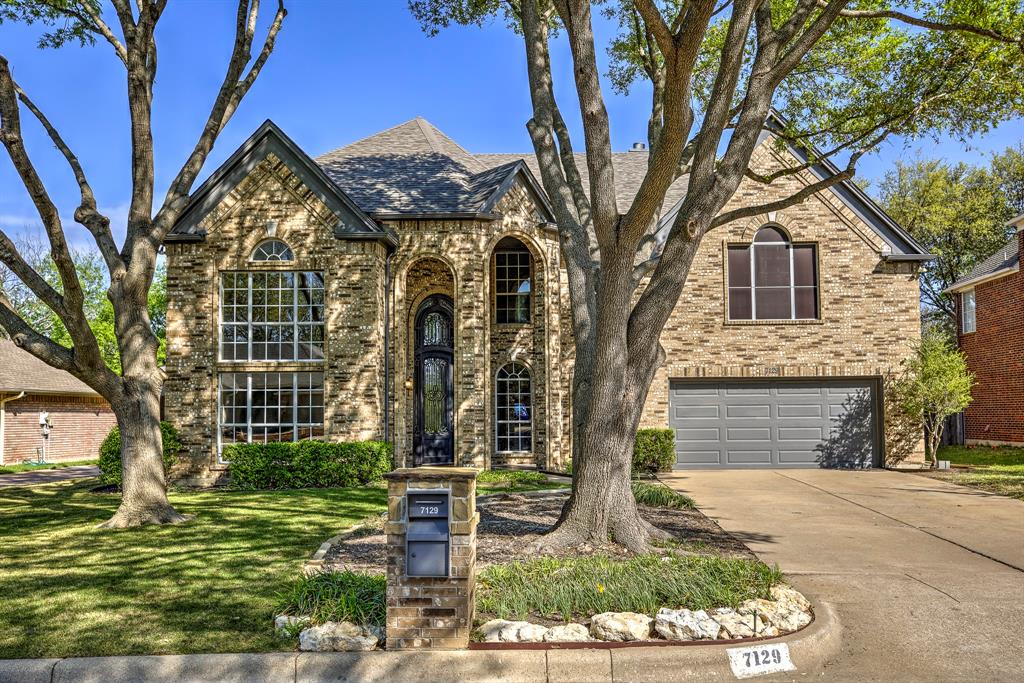 This stunning two-story home sits on a spacious lot backing to a serene creek, offering both privacy and natural beauty. Upon entry, you're welcomed by a grand custom iron door and soaring ceilings. The formal living and dining rooms are ideal for entertaining, while the inviting family room features a gas log fireplace and elegant built-ins. The updated kitchen boasts modern countertops, a generous pantry, and ample workspace. The oversized primary suite includes two walk-in closets and a beautifully updated en-suite bathroom with dual vanities, a soaking tub, and a separate shower. Also upstairs, you'll find two additional guest bedrooms with large closets and an updated hall bath, plus a versatile loft-style living area. A dedicated study downstairs could easily serve as a fourth bedroom. The backyard is perfect for gatherings, complete with a large patio, built-in grilling station, and a storage building. A brand-new Class IV roof was installed in 2024 for added peace of mind.