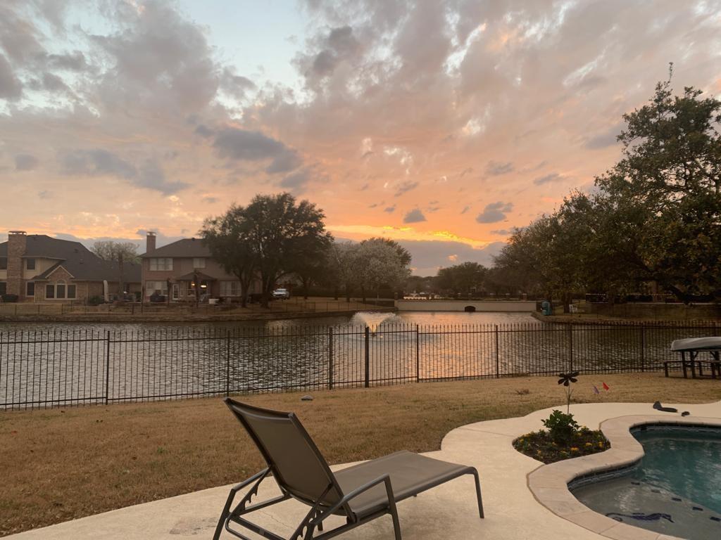 Nestled on a premium lakefront cul-de-sac lot, this exceptional 5-bedroom, 3-bath residence offers the perfect blend of elegance, comfort, and resort-style living. From the moment you step through the grand two-story entry, you'll be captivated by soaring ceilings, rich hardwood floors, abundant natural light, and picturesque water views that create an unforgettable first impression.

Designed for both everyday living and entertaining, the thoughtfully crafted floor plan features two bedrooms and two full baths on the main level, including a luxurious primary suite overlooking the lake. The spacious family room flows seamlessly into the well-appointed kitchen, complete with generous cabinetry, expansive counter space, and a large breakfast bar ideal for gathering with family and friends.

The private primary retreat offers a peaceful escape with tranquil waterfront views, a spa-inspired bath featuring dual vanities, a soaking tub, separate shower, and a spacious walk-in closet. Upstairs, you'll find three additional bedrooms, a full bath, and versatile living space perfect for a game room, media room, home office, or study area.

Step outside to your own backyard oasis where a sparkling pool and spa, covered patio, mature shade trees, and expansive lawn create the ultimate setting for relaxation and entertaining. Enjoy breathtaking sunsets, serene lake views, and direct access to one of the neighborhood's most desirable waterfront settings.

Rarely does a home combine a premium lakefront location, cul-de-sac privacy, pool and spa, mature trees, and a highly sought-after two-bedroom-down floor plan in one remarkable package. This is a unique opportunity to experience luxury waterfront living at its finest.

Note: Property is listed for Sale OR Lease.