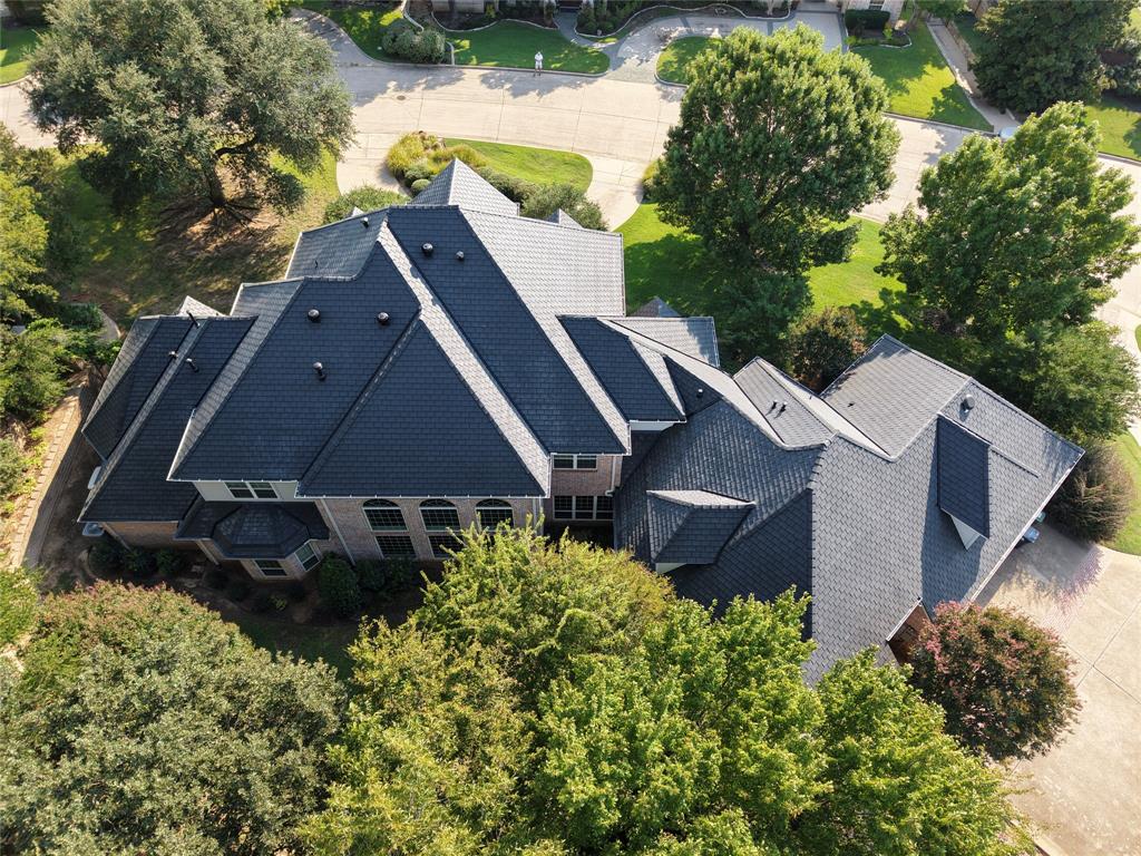 Multi-generational possibilities! Custom, Quality and Convenience! Need extra space for extended family, guests, hobbies, or working from home? Situated on a private, gated 0.92acre lot, this meticulously maintained property showcases quality craftsmanship and thoughtful enhancements by the original builder and designer. Major updates include:DaVinci slate roof, new gutters, new insulated garage doors, whole-house Generac generator with transferable 10-year warranty. A thoughtfully designed 2015 expansion adds a spacious second family room, dedicated office, exercise room, and full bath, providing exceptional flexibility for multi-generational living. Additional highlights include full spray-foam insulation, meticulously maintained mechanical systems, carpeted and “finished out” bonus room ideal for a fitness studio, media room, hobby space, or future guest quarters.
A dramatic 23ft marble entry leads to a formal dining room framed by stately columns flowing seamlessly into expansive family room. The chef’s kitchen, enhancing everyday living and entertaining, features a spacious Butler’s pantry, Sub-Zero and Wolf appliances with custom cherry panels, a Kohler sink, and ASKO dishwasher. The primary suite features a unique rear-projection television system that preserves clean sightlines and minimizes clutter.
Extensive updates include renovated baths soft-close cabinetry, granite countertops, updated fixtures and hardware, framed vanity mirrors, fresh interior exterior paint, remote-controlled exterior lighting, energy-efficient LED recessed lighting, and new carpet throughout upstairs living areas.
Outside, enjoy beautifully manicured grounds, a circular drive, secondary driveway, and oversized three-car garage. This turnkey property offers an exceptional combination of luxury, flexibility, energy efficiency, and enduring quality.
Rarely does a home offer this level of privacy, space, craftsmanship, and confidence-inspiring care.