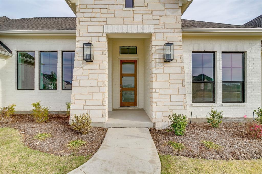 20k YOUR WAY INCENTIVE!  Stunning new construction on a private 1-acre homesite with mature trees backing the property, featuring the sought-after Avery floor plan just minutes from everything Waxahachie has to offer. This thoughtfully designed 4-bedroom, 3-bath home blends luxury, function, and energy efficiency with soaring 20-foot vaulted ceilings in the family room, a cast stone fireplace surround, upgraded designer lighting, and rich wood flooring throughout the foyer, family room, kitchen, dining, and study. The gourmet kitchen is a true showstopper with extended ceiling-height cabinetry, pot and pan drawers, trash pull-out, hidden rollout shelving, utensil drawer, oversized pantry, gas cooktop, and tankless water heater — all powered by a 500-gallon propane package. Tray ceilings add architectural interest in the primary suite, study, kitchen, and game room, while spray foam insulated exterior walls enhance comfort and efficiency year-round. The luxurious primary suite offers a spa-inspired retreat with a custom oversized walk-through shower and a 6-foot freestanding soaking tub. Bedroom 4 features its own private ensuite, perfect for guests or multigenerational living. Additional highlights include two stacked washer-dryer connections, an epoxy-coated 3-car garage with insulated doors, and exceptional storage throughout. Ideally located just 1 mile from Lake Waxahachie with park access, 2.5 miles from I-35, 3 miles from Historic Downtown Waxahachie, and close to the new Waxahachie Creek High School — this home delivers space, style, and convenience on a rare acre lot. A true must-see!