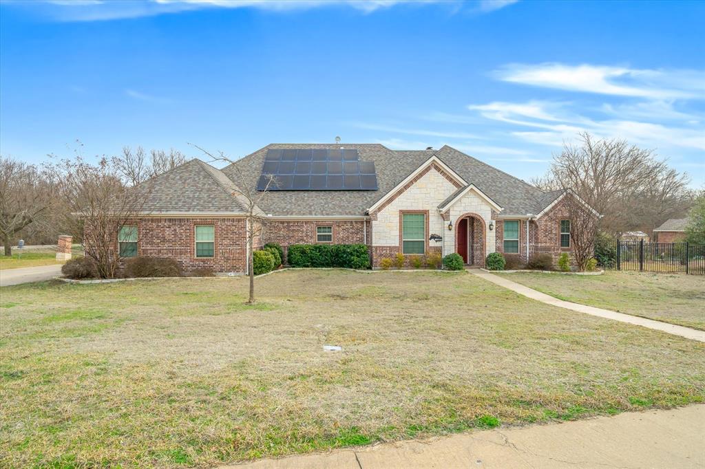 Welcome to refined country luxury in the heart of Farmersville, where elegance, innovation, and expansive Texas living come together on a pristine one acre estate.

Spanning 2,922 square feet, this distinguished residence offers 3 spacious bedrooms and 2.5 baths, thoughtfully curated for elevated everyday living and unforgettable entertaining.

Inside, sophisticated design meets warm comfort. The inviting living room is anchored by a stunning gas fireplace, creating a cozy yet refined focal point for gathering. A formal dining room sets the stage for elegant dinners, while the beautifully appointed kitchen is a true showpiece, featuring premium appliances, a massive wine cooler, and a built in ice maker, perfectly suited for hosting at any scale. The charming breakfast nook offers a peaceful space to start your mornings in style.

Versatility defines this home, with a dedicated office, an expansive game room ideal for entertaining, and a private craft room that can easily serve as a creative studio or additional flex space.

Luxury extends beyond beauty into thoughtful functionality. The home is equipped with solar panels, a whole house generator, and a central vacuum system for ultimate convenience and efficiency. A reinforced safe room ,tornado shelter provides an added layer of security and peace of mind.

Step outside to your private outdoor retreat, where a second gas fireplace enhances the covered back porch, creating the perfect year round setting for relaxing evenings or hosting guests under the Texas sky.

The full acre offers space, privacy, and possibility, while the three car garage ensures ample room for vehicles, storage, and hobbies.

This is more than a home, it’s an executive style country estate offering upscale amenities, modern resilience, and timeless comfort.