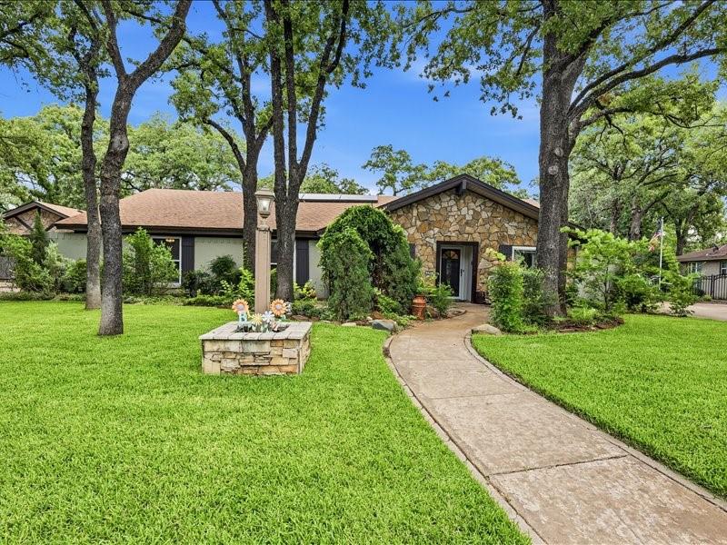 Nestled beneath a canopy of mature trees in an established neighborhood, this home offers the perfect blend of character, comfort, and efficiency. With no HOA and a great location close to shopping, dining, parks, and major commuting routes, you'll enjoy both convenience and privacy.

Step inside to discover an open-concept layout featuring rich wood-look tile flooring, exposed beams, custom stone accents, and a spacious living area centered around a cozy fireplace. The kitchen is designed for entertaining with granite countertops, abundant cabinetry, stainless steel appliances, and a large island.

The primary suite offers a stunning spa-inspired bath with a large walk-in shower, modern finishes, and generous storage. Secondary bedrooms provide flexibility for family, guests, or a home office.

Outside, your private backyard retreat awaits. Relax under the covered patio, host gatherings around the sparkling pool, or simply enjoy the peaceful setting surrounded by mature shade trees. The pool safety fence offers added peace of mind and flexibility for families with children or pets.

Energy-conscious buyers will appreciate the solar panels, helping reduce utility costs while providing long-term value.

This home combines timeless charm, a backyard built for entertaining, and the freedom of no HOA restrictions. Don't miss the opportunity to make this exceptional property your next home.
Roof is 2-3 years new. New electric water heater in pool room. Hvac replaced 2-3 years ago.