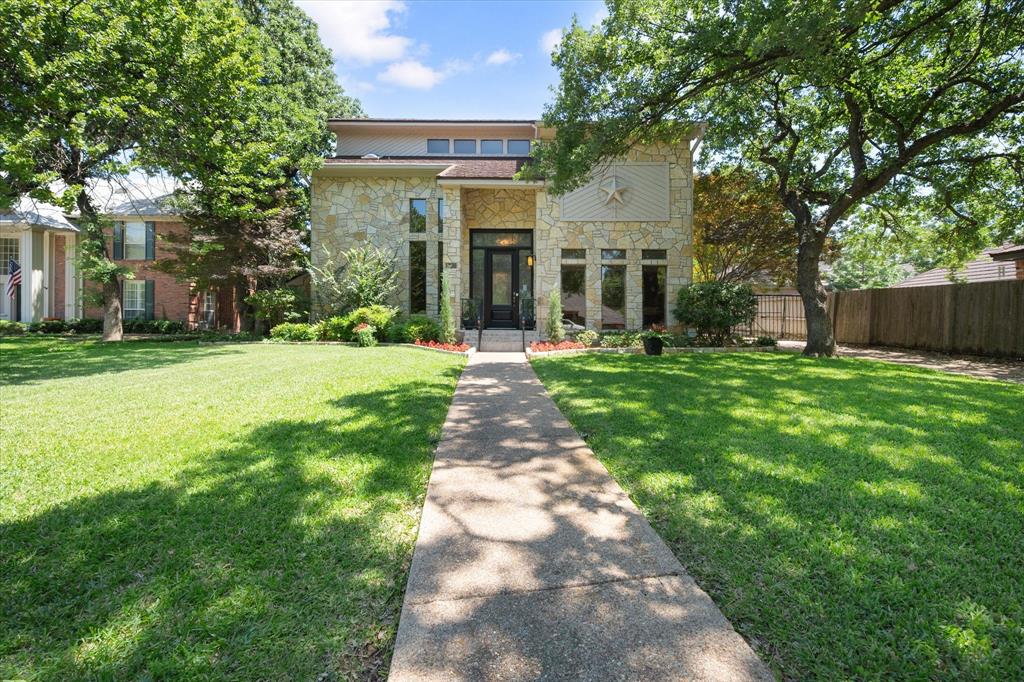 NEW PRICE. SAME INCREDIBLE HOME!! Welcome to 4917 Wareham Drive, nestled in the prestigious Estates above Wimbledon in Arlington, TX. This stunning full-stone contemporary home offers a thoughtfully designed floor plan with 4 bedrooms, 3.5 baths, and 3,048 square feet of beautifully appointed living space. Priced to reflect cosmetic updates, this is a rare opportunity to add your personal touch to an exceptional floor plan in a prestigious community. From the moment you step inside, the soaring atrium windows in the breakfast room and a dramatic wall of windows in the living room flood the home with natural light and frame breathtaking views of the backyard. The catwalk staircase adds an architectural element that is both striking and functional. The kitchen features a center island, breakfast bar, granite countertops, and double convection ovens. The primary suite is a true retreat, boasting double closets and direct access to the incredible backyard oasis.
Speaking of backyard… Step outside and discover a rare double backyard option, perfect for entertaining, gardening, AND storing the boat or RV. The covered patio, outdoor sauna, and beautifully designed garden create a private sanctuary, while the breezeway to the garage adds everyday convenience.
Conveniently located with easy access to major highways, hospitals, and DFW Airport. Schedule your showing today!