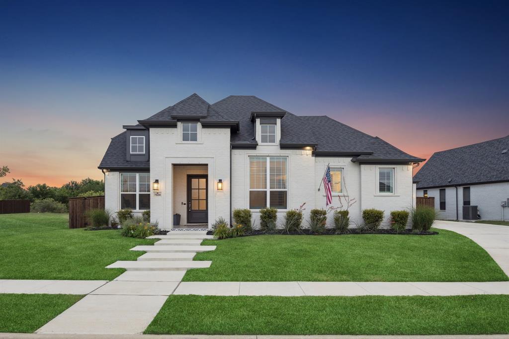 Step into luxury with this designer curated & highly customized Windmiller home, situated in the highly sought after Canyon Falls community & zoned Argyle ISD. Backing to a greenbelt, this very private lot (with the option to change to open greenbelt fencing) offers elevated living inside & out. Impressing upon first glance, the 8ft Mahogany front door with Flemish glass and beautifully-tiled entry sets the tone for the custom finishes throughout. Inside, this expansive one-story layout features wood flooring, caviar-painted 8ft doors, and modern 6in trim with cased openings to create an elegant, seamless flow between all living spaces. The dining room stuns with LED tray ceilings with color-changing lighting for just the right ambiance. Located in the heart of the home, a top-of-the-line kitchen is outfitted with Cambria Level 4 matte black quartz counters, Monogram and GE appliances, and custom cabinetry. A floor-to-ceiling cultured stone fireplace anchors the main living area, while custom shutters throughout the home elevate both privacy & style. Primary suite is a showstopper, with vaulted ceilings, 20ft wood beam & Pottery Barn Remington chandelier. Spa-inspired bathroom features a frameless glass shower with an Emerge shower system, Delta Zura black and chrome fixtures and double vanity. Smart home features include pre-wired surround sound system, hardwired 6-camera system & dual Nest thermostats. Step outside to enjoy an oversized 15’ x 30’ lighted custom pool, complete with tanning ledge, spa, and fountains all designed to maximize this premium lot. Outdoor living showcases a covered outside grill area with extended patio. Highlight of home for many is the extra tall 12' epoxied garage with 10' Garage Door, oversized in width & length, offering rare find for larger vehicles or boat. HOA includes front yard care, cable, internet,and more. Some backyard photos are virtually rendered. Seller offering landscape allowance and rate buy down with acceptable offer.