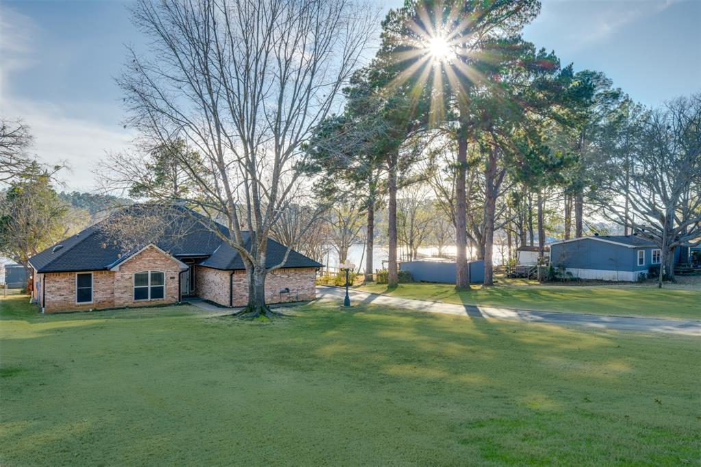 This is the Lake Palestine waterfront property you have been looking for! Located in Bullard, on the East side of the lake, this1,663 sq ft 3 bedroom, 2 bath home sits on one of the two lots being offered. The other lot is available to build on, expandinto, or sell! Total acreage is 1.14 acres. The Cedar Bay subdivision allows for short term rentals. The seller had the homebuilt and they have been the sole owners of this property for 30 years. Roof and gutters are new as of fall of 2024. 2 bayboat dock with lifts and a storage building in the backyard for all the garden equipment. Lovingly cared for over the years anda perfect opportunity for a new buyer.