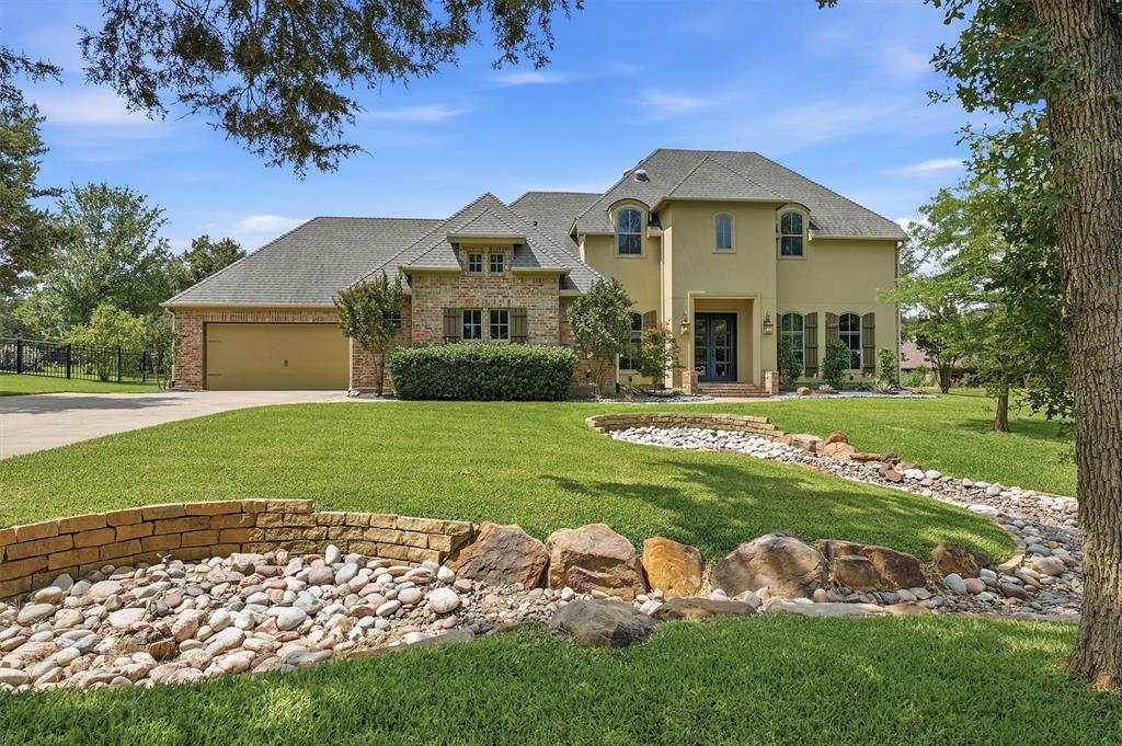 Luxury, comfort, and exceptional craftsmanship come together in this one-of-a-kind 4-bedroom, 3.5-bathroom home nestled within the gates of Lake Kiowa. This stunning property showcases timeless finishes, resort-style outdoor living, and an attached private guest suite complete with its own living area, bedroom, and full bath—ideal for guests, multigenerational living, or a private retreat. Magnificent coffered ceilings stretch across the kitchen, living, and dining areas, creating a dramatic focal point while enhancing the home's open feel. The chef's kitchen is a true showpiece, featuring beautiful brick accents, an oversized island perfect for meal preparation and entertaining, and expansive windows that fill the home with natural light while showcasing views of the backyard oasis. The dreamy owner's suite serves as a private sanctuary with soaring ceilings and direct access to the covered back patio, allowing for seamless indoor-outdoor living. Functionality is equally impressive with a spacious mudroom and office area conveniently located off the oversized three-car garage. Upstairs, generously sized guest bedrooms provide comfort and privacy for family and visitors alike, while a spacious shared bathroom serves the upper-level living quarters. Step outside to your own private resort. The sparkling swimming pool, relaxing hot tub, and inviting outdoor living spaces create the perfect setting for entertaining, weekend gatherings, or peaceful evenings under the Texas sky. Beyond the home, Lake Kiowa offers a lifestyle unlike any other. Residents enjoy access to a private lake, championship 18-hole golf course, 9-hole par-3 course, driving range, and dedicated chipping and putting facilities. Beaches, sports courts, parks, playgrounds, and scenic walking trails provide endless opportunities for recreation and relaxation. This extraordinary property presents an opportunity to enjoy luxury living at its finest.