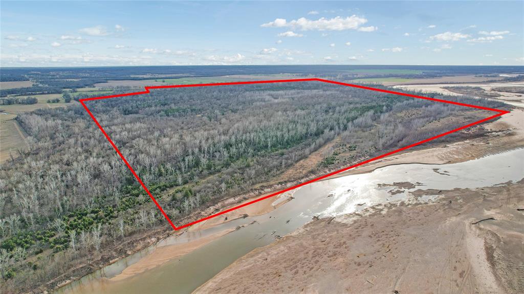 Premier Red River Hunting Property ,378± Acres, Lamar County, TX !! MOTIVATED SELLERS!!!
This is a true turnkey hunting and recreational property offering elite habitat, water, and diversity rarely found in one tract. Located just outside Paris, Texas, this 378± acre property features nearly three-quarters of a mile of Red River frontage and is loaded with wildlife and improvements.
The property supports exceptional populations of whitetail deer, wild hogs, turkey, and waterfowl, with four established duck sloughs and proven migration activity. Wildlife is abundant and diverse—if it crawls, walks, or flies in the State of Texas, it likely inhabits this property, with even nearby sightings of black bears and mountain lions. Multiple food plots, shooting lanes, and travel corridors are already in place, creating excellent huntability throughout the property. Most feeders and stands convey, making this a plug-and-play operation for the upcoming season.
A rustic 3-bedroom, 1-bath cabin provides comfortable lodging with an open living, dining, and modern kitchen layout. Positioned on a high bluff, the covered porch offers commanding views of the land and river bottom. Additional infrastructure includes a 21’ x 40’ conex with attached canopy for secure storage, a large covered equipment or RV canopy, and a fire pit for post-hunt gatherings.
The Red River adds unmatched recreational value with fishing, boating, swimming, and access to large sandbars ideal for camps, cookouts, and family events. Wildlife diversity is exceptional, and the property has a long track record of producing trophy-quality game.
Hunting properties with this level of water, habitat, infrastructure, and Red River frontage are extremely rare in Northeast Texas. This is a premier opportunity for a private hunting retreat, family legacy property, or long-term land investment.