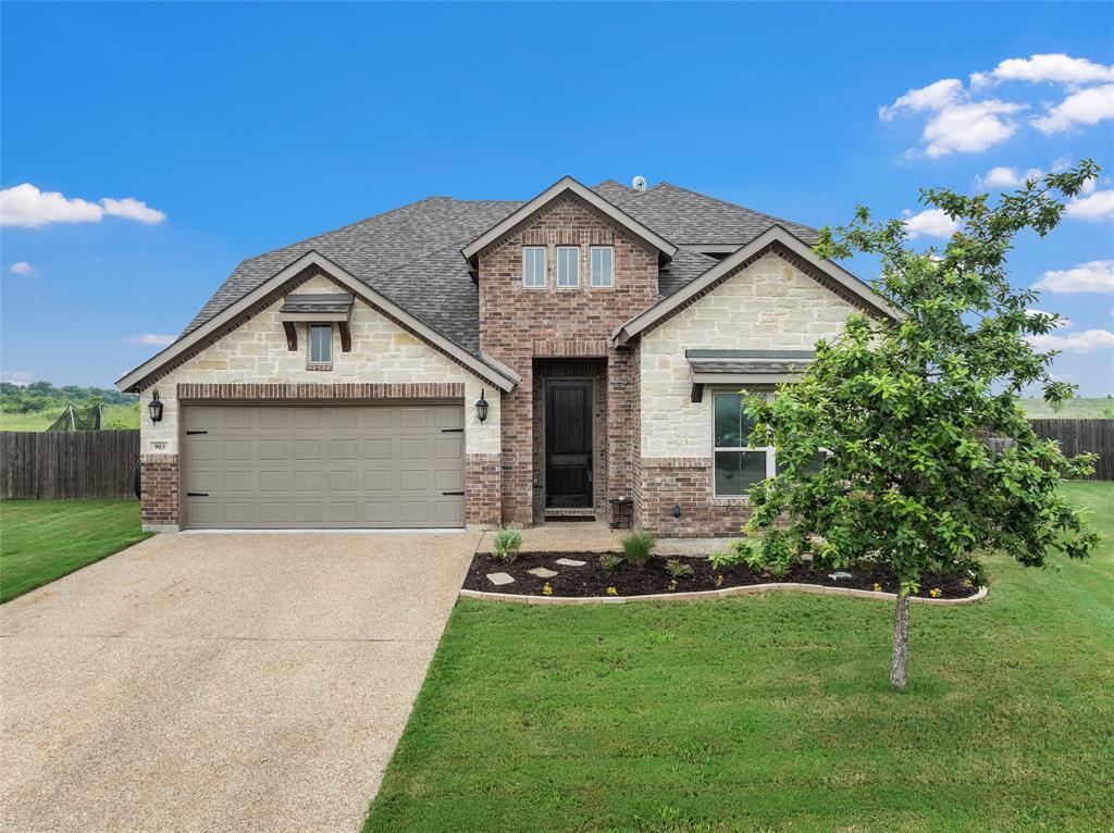 Welcome to 903 Dublin Ct, a stunning two-story home tucked away on a peaceful cul-de-sac in the heart of McGregor, TX. Built in 2019, this spacious residence offers 6 bedrooms and 4 full bathrooms, including the unique potential for two primary suites, perfect for multi-generational living, guests, or flexible lifestyle needs. Step inside to discover two inviting living spaces, ideal for gathering or relaxing, anchored by a charming wood-burning fireplace that adds warmth and character. The open-concept kitchen flows seamlessly into the main living area, offering an ideal layout for large gatherings. Upstairs and down, the home provides abundant space, privacy, and comfort for everyone. Outside, enjoy a covered back patio, perfect for morning coffee, along with neighborhood sidewalks that promote easy strolls and added safety. This home delivers the privacy you want with the convenience you need. All in a beautifully designed modern build. 903 Dublin Ct offers exceptional space, thoughtful features, and a welcoming setting, ready to become your next home!