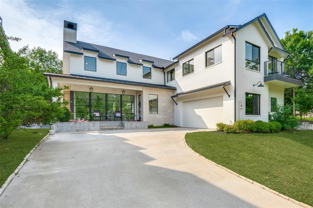 Steps from Flagpole Hill Park, this 2018 modern farmhouse sits on a 3rd of an acre with an elevated topography, providing privacy & treehouse feel. Features include:  floor to ceiling windows across front & back; two-story living room with designer trusses, chandeliers & spectacular gas fireplace; modern kitchen with quartz waterfall island, Carrara backsplash & stainless appliances; stained concrete in downstairs living areas with wide-plank white oak flooring throughout rest of home.  The home offers a spacious primary suite downstairs, 3 additional bedrooms upstairs & a study that could be converted to a fifth.  All baths (3 full, 2 half) feature marble & quartz finishes & specialty lighting. Enjoy a large upstairs game room with built-in console & balcony overlooking lush front yard.  New pool, spa and covered patio provide amazing entertaining space and place to relax. The home features a gravel fire pit, outdoor shower, custom lighting & window treatments. White Rock Elementary.