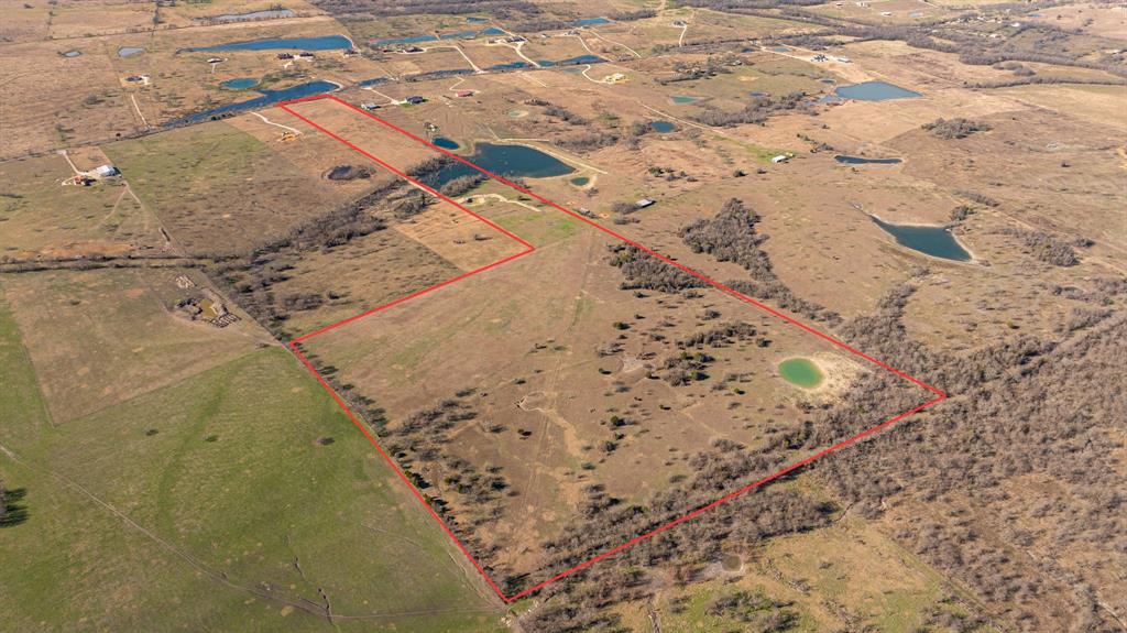 Discover 61.51 ACRES OF WIDE OPEN TEXAS PARADISE, perfectly suited for a PRIVATE FAMILY COMPOUND, WEEKEND RETREAT, OR WORKING RANCH. This stunning property offers SUNSET VIEWS TO DIE FOR, a rare mix of MULTIPLE PONDS, scattered trees, and expansive cleared acreage ideal for livestock, agriculture, or future development. Whether you envision building your dream estate, creating a recreational getaway, or establishing a self-sustaining homestead, the possibilities here are endless. Enjoy peaceful country living with the convenience of being just 10 minutes from Ennis and ONLY 30 MINUTES FROM DOWNTOWN DALLAS. Properties of this size and location are increasingly RARE, don’t miss the opportunity to own a versatile tract that offers space, privacy, and accessibility in one exceptional package.