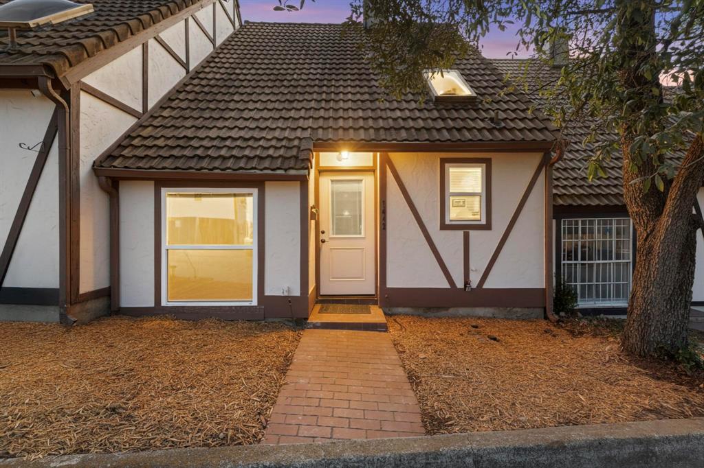 No HOA! This updated 2 bedroom 2 bathroom townhome is conveniently located between Fort Worth and Arlington with views of Meadowbrook Golf Course. Recent updates include fresh paint, flooring, fixtures, windows, and new front door. The main level features the living space with towering ceilings and fireplace, a well-equipped kitchen with all stainless appliances, primary bedroom with ensuite bath and walk-in closet. The second floor features the secondary bedroom with ensuite bath. This property is perfect for the first-time buyer, downsizer, or investor looking to capitalize on a conveniently located property with long-term and short-term rental opportunities.