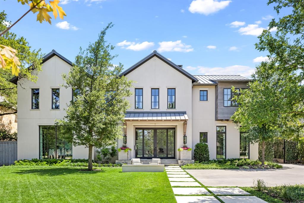 Nestled on a generous 95 x 150 lot along one of University Park’s most coveted blocks, this timeless 5-bedroom, 5.2-bath estate was originally built by Tatum Brown and masterfully reimagined by SHM Architects. Interiors by Morgan Farrow blend sophistication and warmth, with exquisite Calacatta marble, bespoke Ornare cabinetry, and designer finishes throughout. The recently updated home boasts exceptional amenities, including an elevator, fitness room, game room, and smart home automation. The luxurious primary suite is a serene retreat, featuring a spacious bedroom, private sitting room, newly designed dual custom closets, automated shades, and a spa-inspired bath outfitted with a Victoria & Albert soaking tub, marble countertops, a marble-tiled shower bench, dual Auto Toto Neo toilets, and an indulgent steam shower with rain head and body jets.  Designed for seamless indoor-outdoor living, the lushly landscaped backyard offers a resort-style pool, sports court, artificial turf, a covered patio, and a private terrace with sweeping views—perfect for year-round entertaining and relaxation.