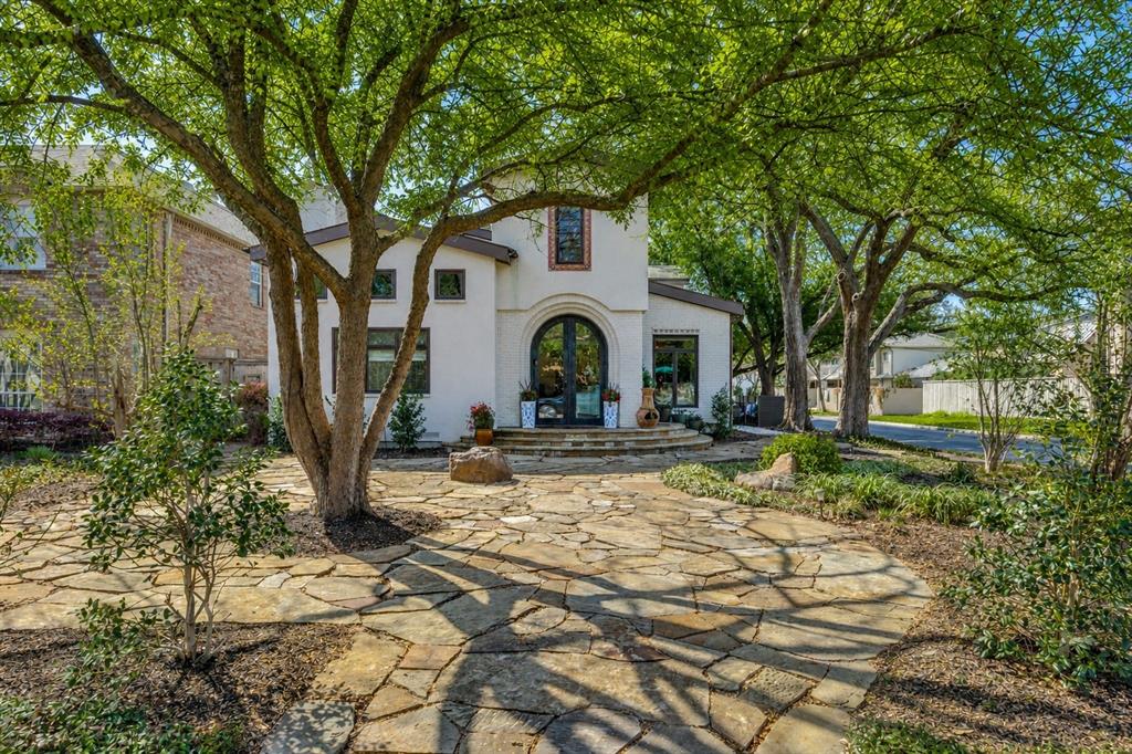 A rare expression of sophisticated soft contemporary design, this custom-built residence offers museum-quality architecture, exceptional craftsmanship, and effortless livability in the coveted Bradfield Elementary area of HPISD.

Designed for the original owner with uncompromising attention to detail, the home features a curated palette of stone, steel, glass, and white oak. Light-filled spaces flow seamlessly beneath soaring two-story ceilings, ideal for both grand entertaining and everyday living.

Dramatic living and dining areas are framed by clerestory and picture windows, creating gallery-like walls for art. The first-floor primary suite is a private retreat with fireplace, clerestory windows, and a spa-inspired bath with walls of custom white oak enclosed closets, a skylit open shower, and a jetted tub.

The kitchen impresses with extensive custom cabinetry, leathered stone countertops, premium appliances, and a large marble island with more storage and seating areas. A private study adjacent to the kitchen features a built-in desk and file drawers, as well as a separate exterior access to the side yard area.  The sleek utility room with sink and custom cabinets and powder room also enjoy this level.  

The second level offers a spacious open family-media room and two ensuite bedrooms, one being the size of a primary bedroom.  Bath and closet spaces are very generous. Additional features include a floating steel, glass and stone architectural staircase, attached 2-car garage, and low-maintenance turfed outdoor space.