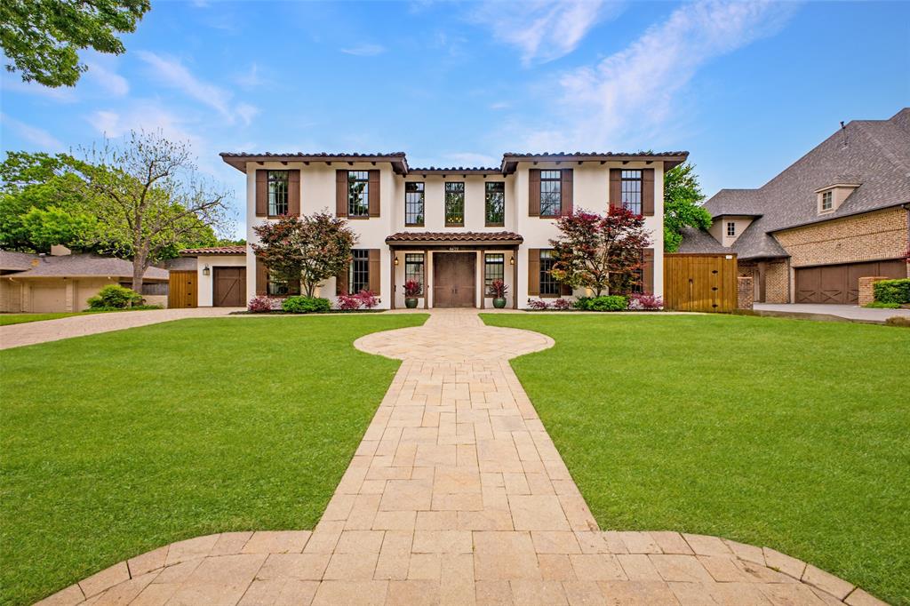 Stunning, clean-lined Mediterranean Revival in exceptional location of Preston Hollow near St Marks, Central Market, Northpark, etc. The light-filled, inviting interior offers an open floorplan with authentic architectural features such as beamed ceilings, arched doorways, 10-inch baseboards, and wrought iron staircase & sconces, all creating a lighter feel. Fabulous space is offered in the most popular areas of the home – the kitchen, breakfast room, and living room. A large center island, breakfast bar, walk-in pantry, and Wolf & Sub-Zero appliances highlight the gourmet kitchen. The magnificent 2 story study-library is a focal point of the downstairs providing endless space for your book collection and the perfect spot to work or relax. The double-door entry to the primary suite makes one feel like you’re entering a grand suite in the finest hotel. The enormous bedroom overlooks the breathtaking yard & pool, and the luxurious bath with natural stone & glass tiles transitions to separate beautifully appointed closets. Upstairs hosts 4 HUGE bedrooms, each with a private bath and walk-in closet. The media-game room also has a full bath, providing a sixth bedroom if desired. The outdoor paradise begins with a spectacular covered patio with vaulted planked ceiling, ceiling fans, specialty lighting and TV. This is the entrée to the stunning 2022 linear pool with water features and the adjacent kitchen & dining pavilion with built-in grill & gas burner, refrigerator, bar seating, and TV. The large, grassy yard completes the perfect outdoor environment. Extra amenities include a 4-CAR tandem garage, laundry facilities downstairs & Upstairs, plantation shutters & custom window treatments, abundant storage, tankless water heaters, LED lighting, and board-on-board fence!