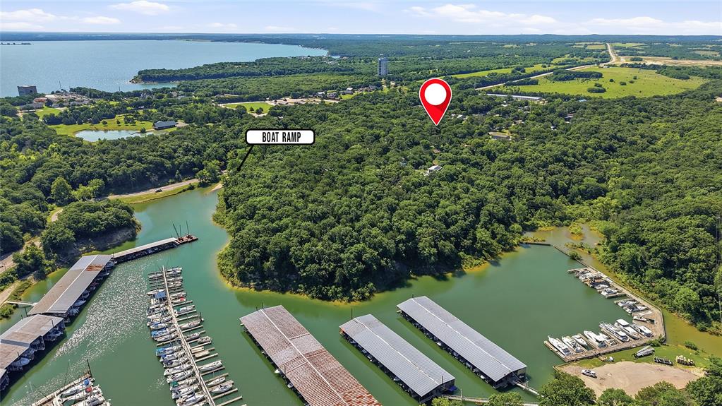 Beautiful shaded lots near Grandpappy's Point on Lake Texoma. These corner lots were recently cleared and have electricity and water available.  Build your barndominium or bring your mobile home, it's ideal for year round living or a summer lake home, just about 1 mile from the marina.  Another boat ramp is located on Hwy 84 just .4 mile away from these lots.  The Preston Harbor development has broken ground and there is a planned Margaritaville Resort that will be just a few minutes away.  No HOA, no MUD or SID, just close access to Lake Texoma and all the fun it brings!

Previous mobile home recently cleared, no operable septic.