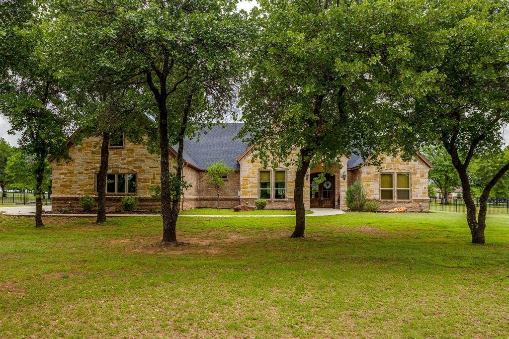 Incredible opportunity to own this custom build at this new price! Over 3 acres in Sugartree with city water and a private well! This nearly 3600 sq ft. custom home offers 4 bedrooms, 3.5 bathrooms, an oversized laundry room, and an extra large 3 car garage. Step through the double doors entry into the soaring cathedral ceilings accented with gorgeous wood beams. The open concept floor plan flows seamlessly, creating the perfect space for living and entertaining.The kitchen, living and dining areas are designed for both functionality and style, making this home a true showpiece. Enjoy the outdoors with a partially fenced large backyard, expansive covered patio and plenty of room to create your own private retreat. Sit back and watch the wild life roam while having a glass of wine or sipping on your morning coffee. Don't miss your chance to own a rare 3+ acre property in Sugartree. Schedule your showing today!