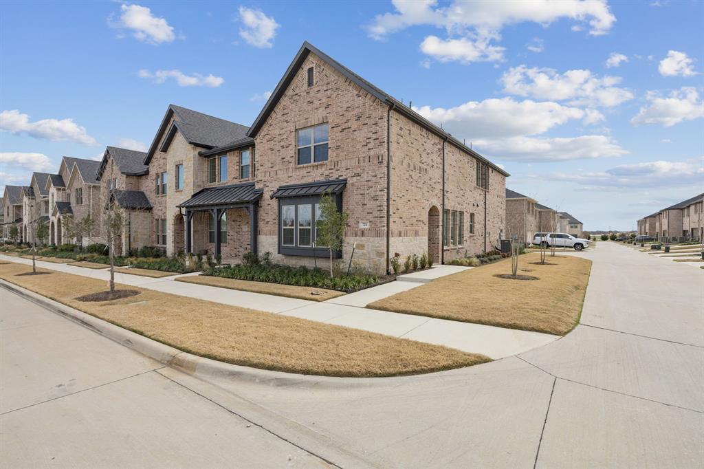 Welcome home to this brand-new, never lived in, beautifully designed three-bedroom, two-and-a-half bath townhome in the highly sought-after Harvest community. Thoughtfully crafted with an open-concept floor plan, this home features an oversized living area—perfect for entertaining, hosting guests, or enjoying everyday living. The modern kitchen is a standout, offering stainless steel appliances, a 5-burner gas range, side-by-side refrigerator, generous counter space, and a pantry, making both cooking and storage effortless. Upstairs, retreat to the spacious primary suite, complete with a dream-worthy walk-in closet designed to impress. An oversized game room provides an ideal secondary living space. Two additional bedrooms provide flexibility for family, guests, or a home office. Ample storage abounds with two linen closets, a coat closet, and thoughtful layout throughout. Situated on a corner lot, this townhome enjoys abundant natural light that enhances its bright and welcoming atmosphere. Basic internet included in HOA dues. Conveniently located just minutes from Chick-fil-A, the coming-soon Tom Thumb grocery store, and I-35W, this home offers both comfort and unbeatable convenience. Don’t miss the opportunity to enjoy brand-new living in one of the area’s most desirable neighborhoods.