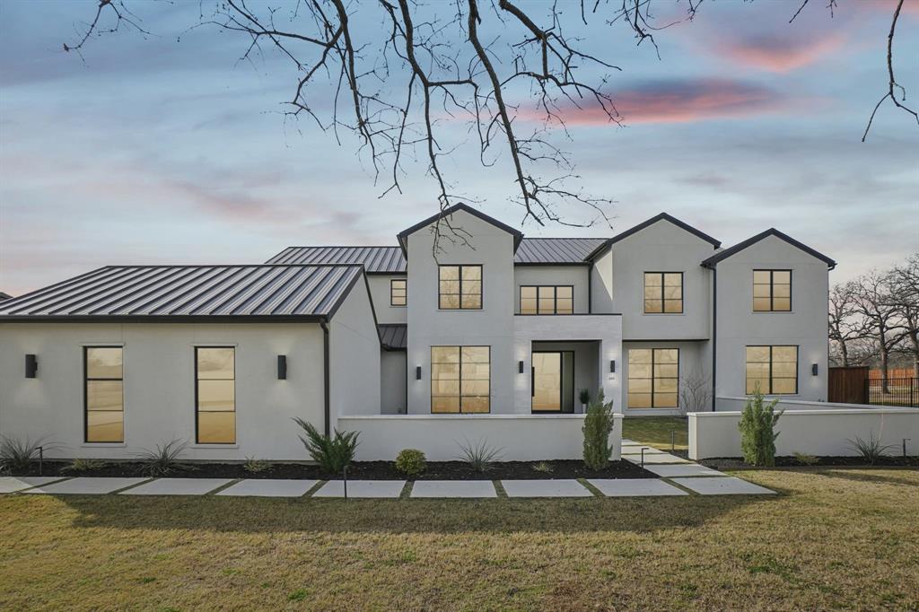 Nestled on a sprawling, private lot of over an acre, this exceptional new home built by Calais Homes offers luxury, space, and thoughtful design at every turn. An electric gated driveway ensures privacy and leads to an impressive 4-car garage. Boasting 6 bedrooms, 7 full bathrooms, and 2 half baths, this home is designed for both everyday comfort and grand-scale entertaining. The great room features an elegant electric fireplace and a dramatic wall of windows that frame serene backyard views. The formal dining room is complemented by a temperature-controlled wine room, perfect for hosting memorable gatherings. The chef’s kitchen is a true showstopper with a built-in refrigerator, commercial-grade gas cooktop and vent hood, oversized island, and abundant cabinetry. A fully equipped prep kitchen provides a second sink, dishwasher, microwave, refrigerator, electric range, and walk-in pantry—an ideal staging space for dinner parties and events. The serene owner’s suite overlooks the pool and showcases a coffered ceiling and a spa-like ensuite with dual vanities, dual toilets, dual custom walk-in closets, an oversized walk-in shower with dual shower heads, and a freestanding soaking tub. The main level also offers a game room with wet bar, media room, and a versatile flex room ideal for a home gym or second study. Upstairs, enjoy a second game room with balcony access overlooking the Texas-sized yard, along with four generously sized bedrooms, each featuring its own ensuite bath. Step outside to a private backyard retreat complete with a sparkling pool, fire pit, covered patio with outdoor kitchen, and expansive green space—perfect for relaxation and entertaining. Ideally located in Southlake, just minutes from Southlake Town Square’s premier shopping and dining, and directly across from The Marq offering tennis courts and additional recreational amenities, this remarkable home delivers luxury living at its finest.