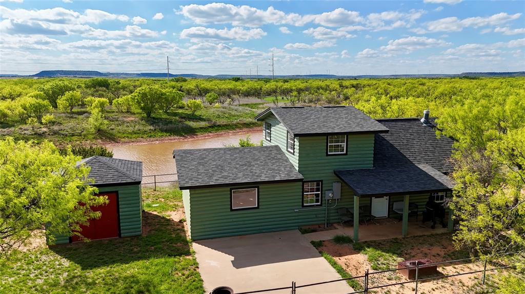 258 CR 206  Tuscola, TX  118± Acres

118± acres of wooded, gently rolling ranchland offering exceptional recreational and rural living opportunities just minutes from Abilene in Jim Ned ISD.

The property features a comfortable 1,000 sq. ft. home with 2 bedrooms, 1 bath, open-concept kitchen and living area, and an upstairs loft with two queen-size beds for additional sleeping space. The spacious living room is anchored by a wood-burning stove, with mini-split units for heating and cooling. The home is electric with a propane instant hot water heater and overlooks a large stock tank from the rear.

The ranch is predominantly wooded with rolling terrain and a creek winding through the property, creating excellent wildlife habitat and natural contour. Four stock tanks (several stocked with fish) provide abundant surface water along with the creek, supporting year-round recreation and wildlife.

Improvements include a pole barn with working pens, hunting blinds and feeders, and fencing consisting of Barnes wire and net. Electricity is available at the home and barn with two electric meters, and there are two water meters in place. Municipal water service is available (buyer to verify). Septic is in place at the main residence. Dual meters provide opportunity for an additional residence.

Wildlife includes whitetail deer, Rio Grande turkey, dove, quail, ducks, and hogs. Suitable for hunting, fishing, cattle, recreation, or full-time country living.

County Road 206 frontage provides convenient access while maintaining privacy.

Contact Teresa Stephens Lee with Stephens Ranch Hand Real Estate to schedule your private showing.