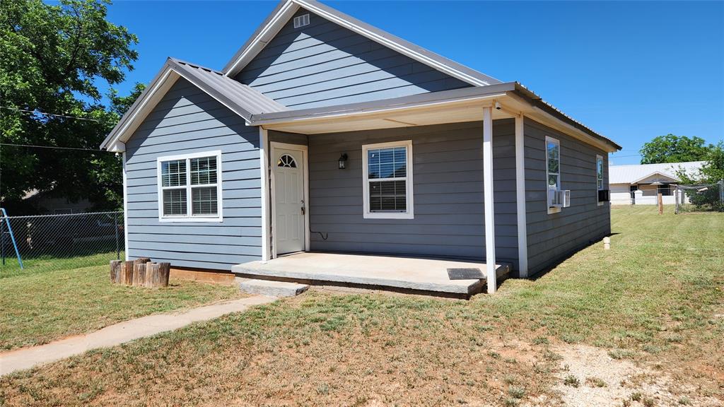 This cute house built on a big lot of land, was remodeled five years ago; the house was only used occasionally by owner and it is still in great shape. Updated exterior paint, electrical, plumbing, metal roof, siding, windows with 2 inch blinds, window curtains, vinyl flooring, drywall, and insulation. Also updated, kitchen cabinets, countertops, sink and bathroom. Utility room was added, includes washer-dryer hookups and a recently purchased water heater.