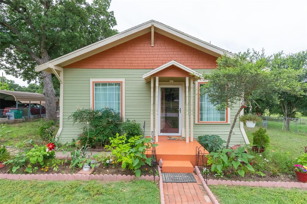 Charming is the best way to describe this historical cottage gem with so much character, it's the kind of home that just feels inviting from the moment you arrive.  This 2 bedroom 1 bath home is filled with natural light and a fresh, airy feel. Inside, you'll find beautiful original hardwood flooring and fresh paint that brighten every room. This home features all large rooms with an extra bonus room that can be used for crafts, a game room or office space.  The kitchen is efficient and practical, making great use of its space for everyday cooking and dining. There is a large detached carport and multiple storage units in the back. Outdoors, enjoy a large lot with a generous backyard, ideal for entertaining, gardening or future expansion.  Call your favorite Realtor today and come see the charm this home has to offer! This property is being sold As-Is Where-Is.