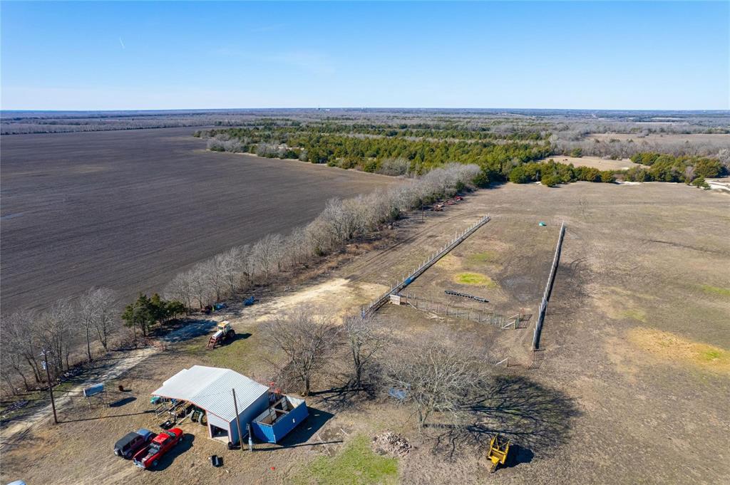 95.13 acres just 6 miles from Bois D'Arc Lake south boat ramp. This tract has endless opportunity from development, commercial, and farm and ranch. Open pastures with slight roll, fenced, shop with parking, ponds, and some trees. This property is a MUST SEE.