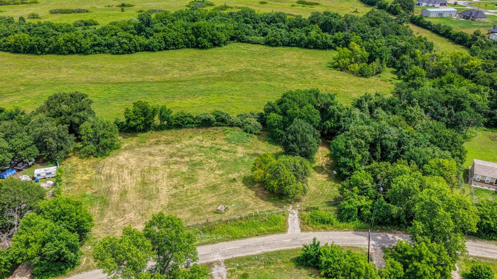 2 Lots side by side, Buy one or both!  Wide lot just under 1 acre with multiple build sites available! Enjoy open land dotted with beautiful trees, all while benefiting from NO CITY TAXES & NO HOA! Conveniently located just 5 minutes from Azle amenities including Eagle Mountain Lake and a quick 35 minute commute to downtown Fort Worth. Animal enthusiasts will love the freedom to bring horses & cattle! Bring your own builder or choose from custom plans with our preferred Zeal Home Builder or opt for semi-custom homes, including Barndominiums!  Explore financing options with Veteran Land Board Loans or low-down conventional options. Still deciding on your dream home? You can invest now and build later, with no time limit to build. Don’t miss out on this opportunity. These rural homesites are ideal for you to own your piece of one of the fastest growing counties in Texas. Don’t wait to buy land, buy land & wait! Txt keyword ZEAL8 to 88000 for more details.